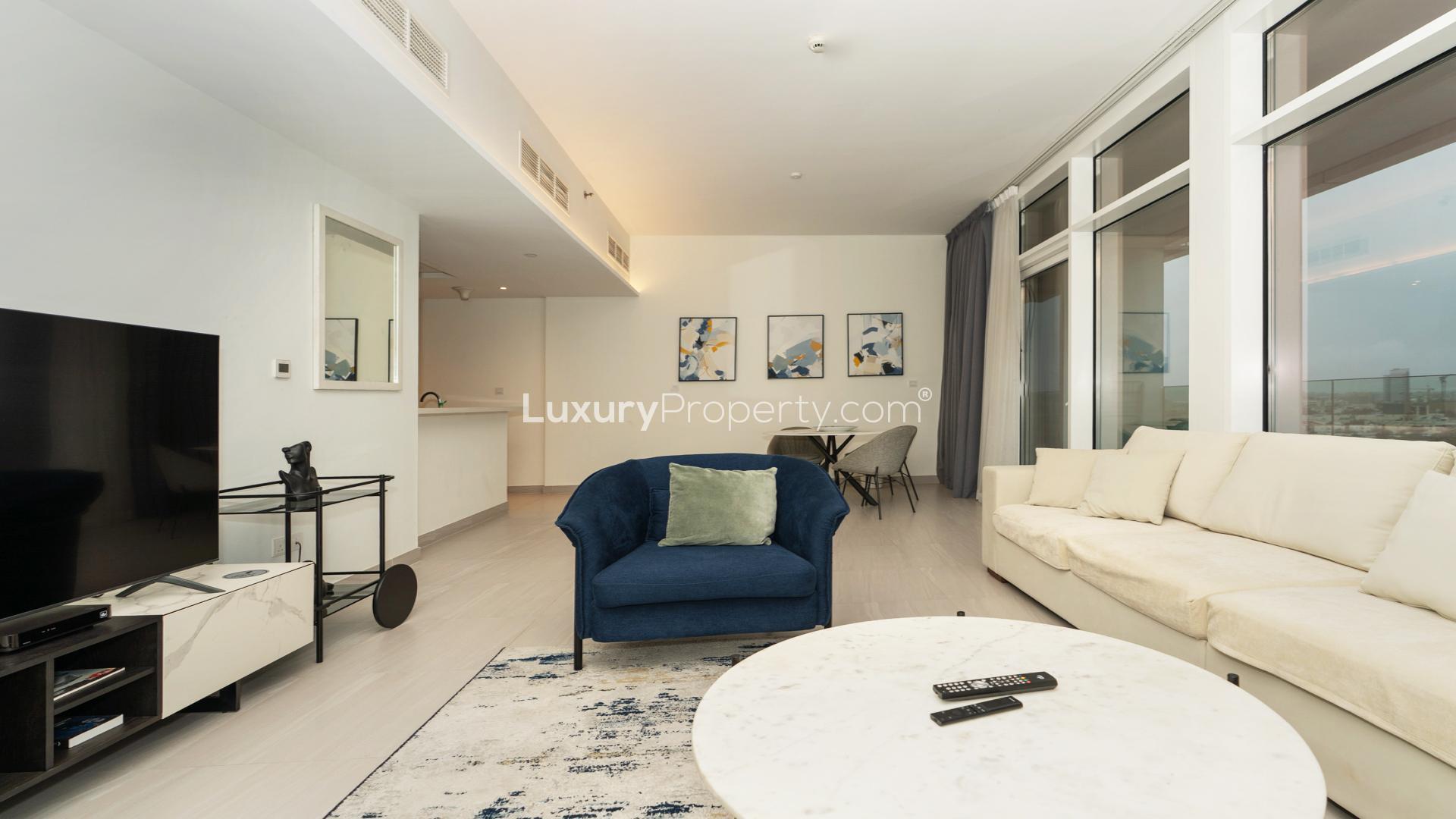 Modern living room in Al Kifaf apartment, Park Gate Residences, with stylish decor and large windows