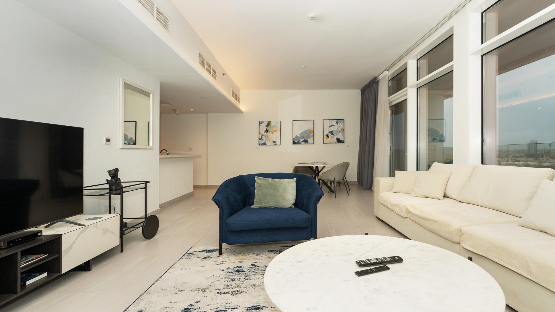 Modern living room in Al Kifaf apartment, Park Gate Residences, with stylish decor and large windows