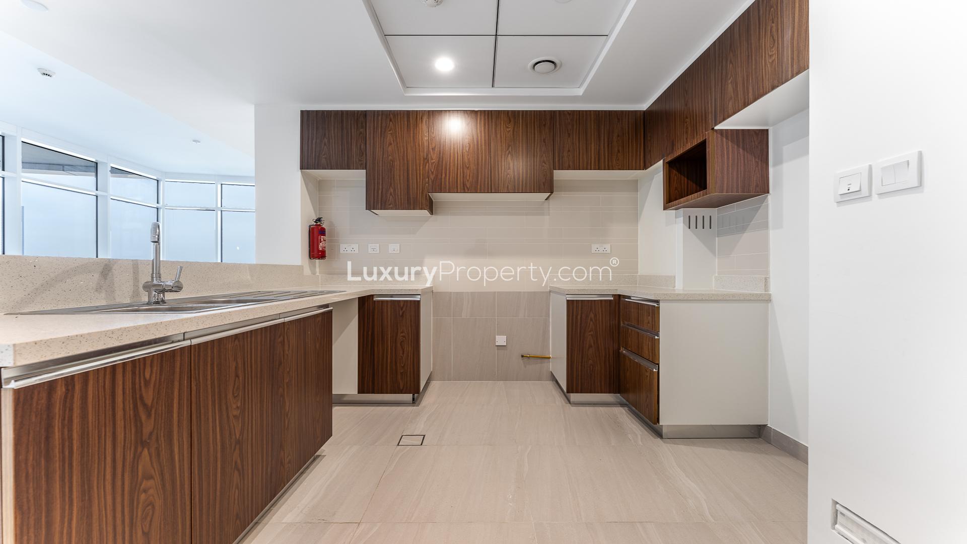 "Spacious balcony with corner view at Park Gate Residences, Al Kifaf apartment for rent.",Modern kitchen in unfurnished 2-bedroom apartment, Park Gate Residences, Al Kifaf