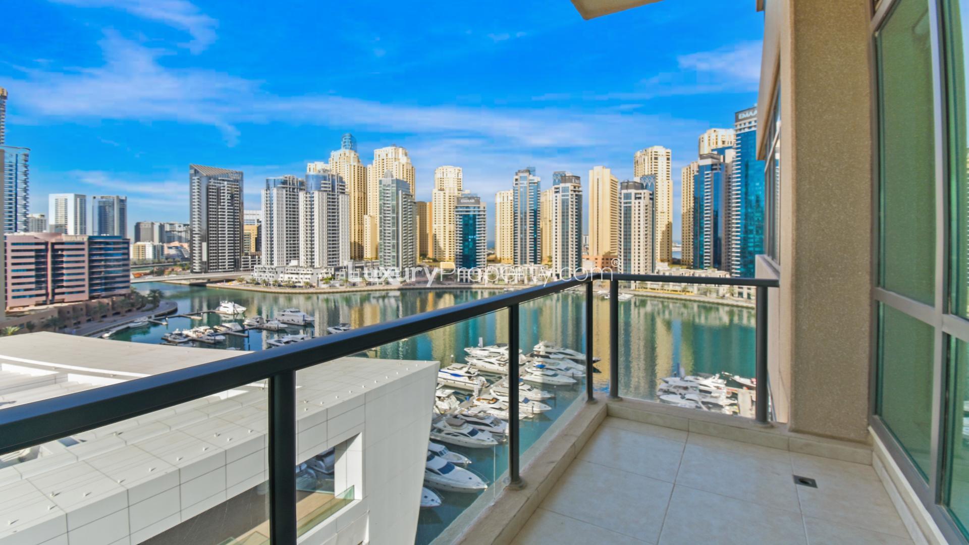 Bright living area with large windows in Dubai Marina apartment, Al Majara, for rent