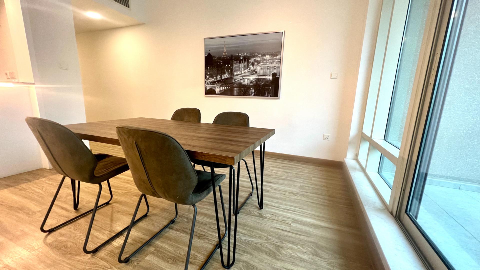 Modern Dubai Marina apartment view with high-rise buildings and waterfront in Al Majara community