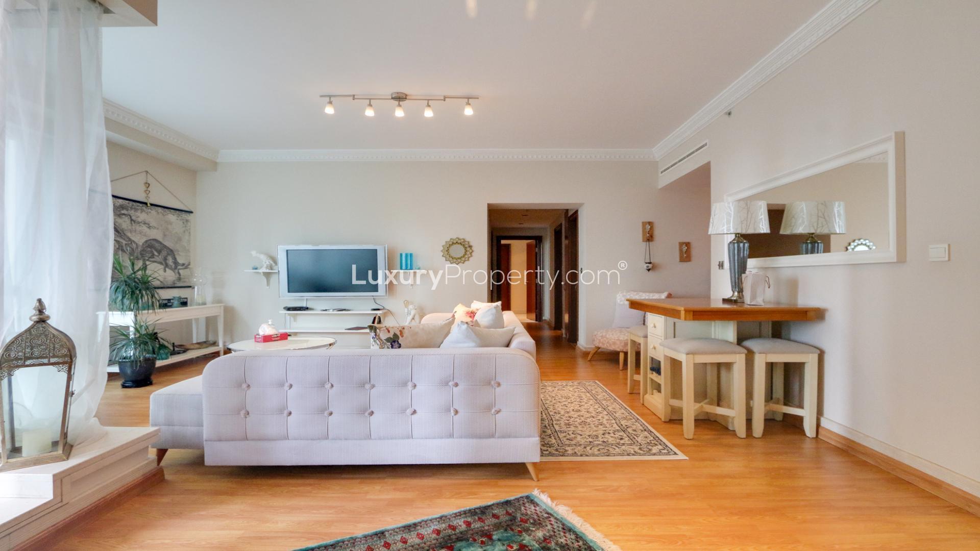 Furnished living room in Dubai Marina apartment with balcony view, Emaar 6 Towers