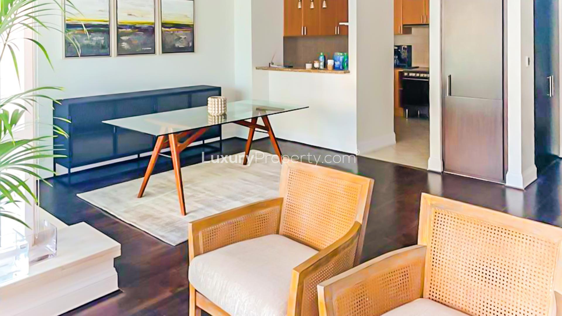 Furnished living room in Emaar 6 Towers apartment, Dubai Marina, with large windows and modern decor