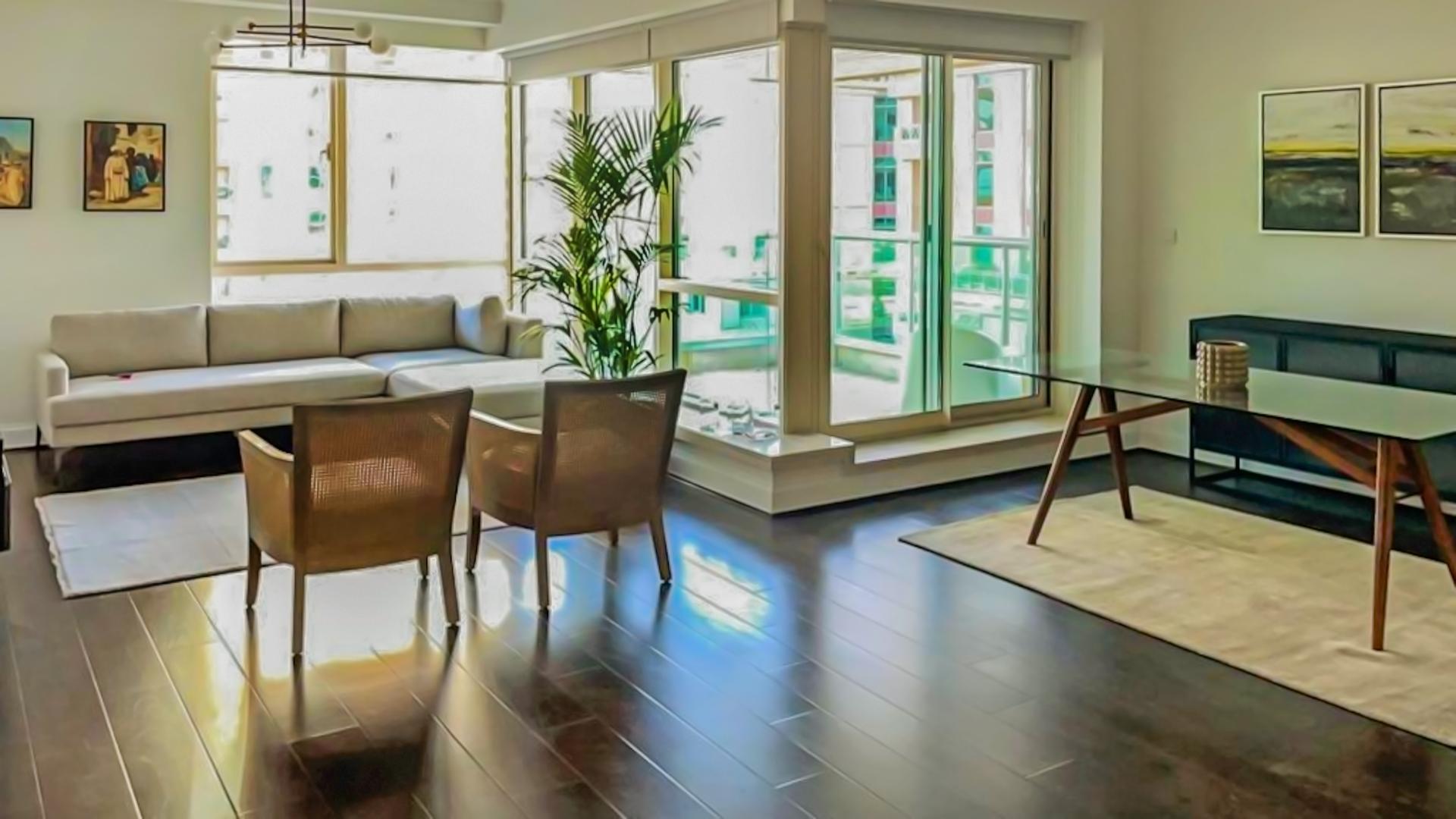 Furnished living room in Dubai Marina apartment, featuring modern decor and large windows