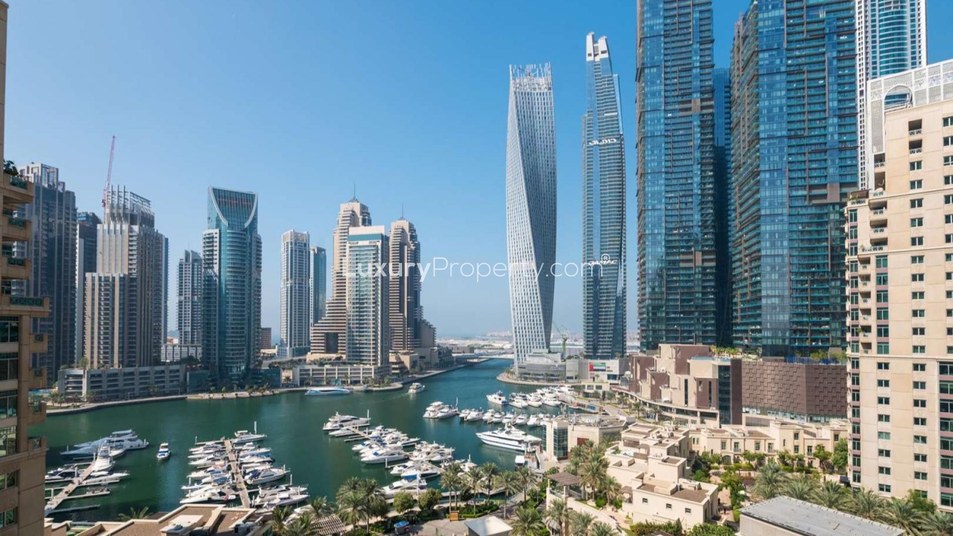 Elegant living room in 2-bedroom apartment, Al Mesk, Dubai Marina, featuring red leather sofas