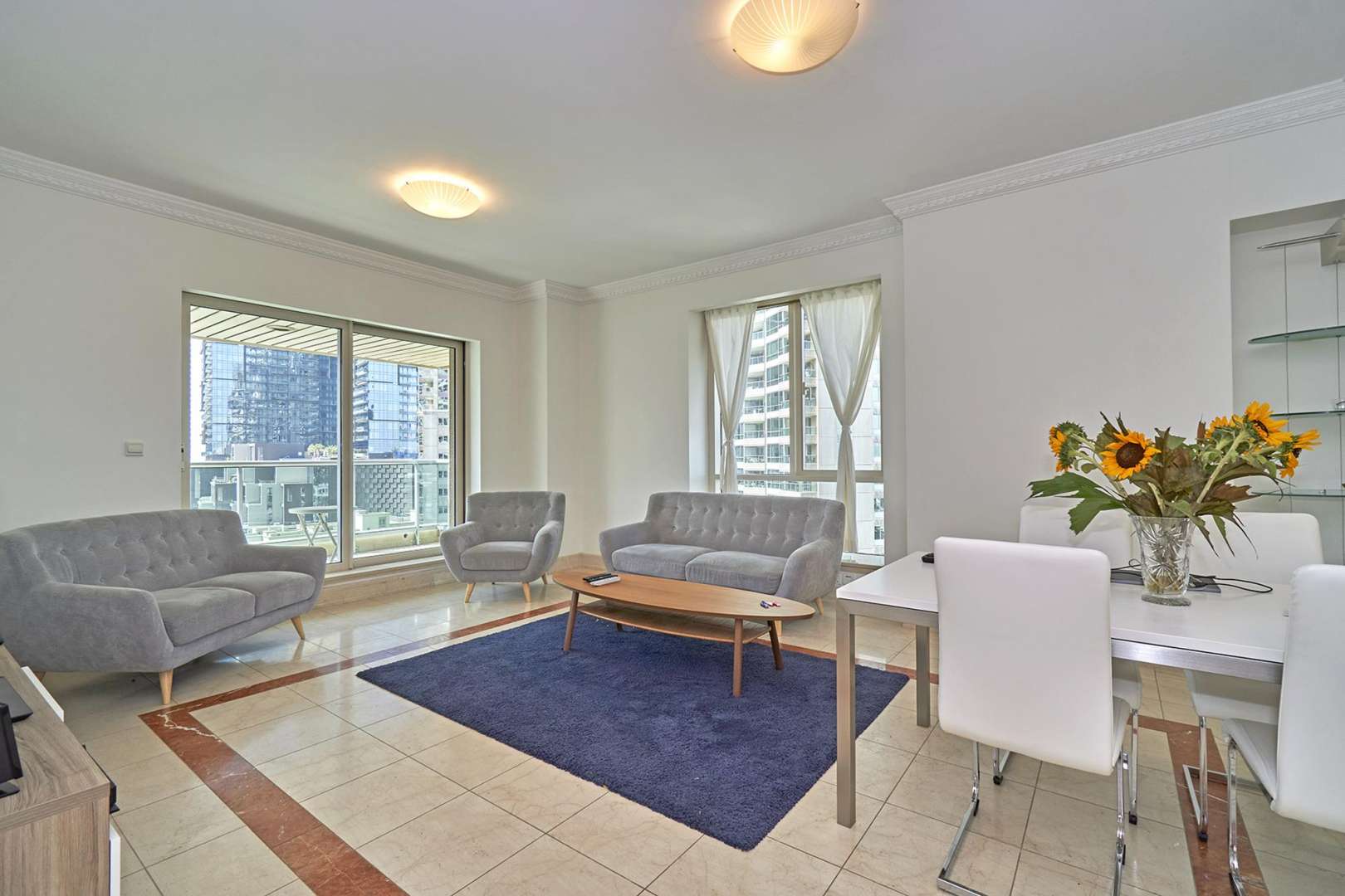 N/A,Furnished living room in 2-bedroom apartment, Emaar 6 Towers, Dubai Marina, with marina views