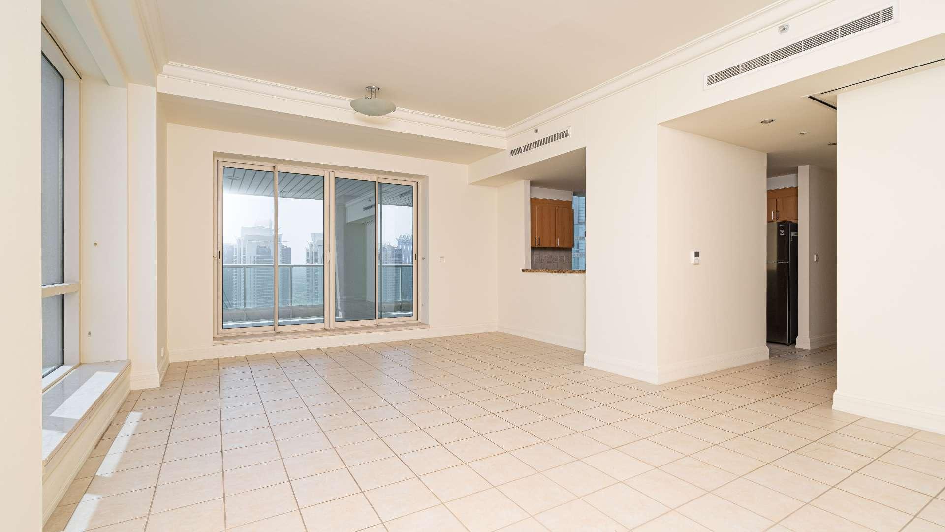 "Stunning view of Dubai Marina from Murjan Towers apartment in Emaar 6 Towers community.","Spacious living area in Murjan Towers two-bedroom apartment, Dubai Marina, with balcony view.","Spacious balcony view from two-bedroom apartment in Murjan Towers, Dubai Marina.",Open-plan kitchen and living area in Murjan Towers apartment, Dubai Marina, Emaar 6 Towers