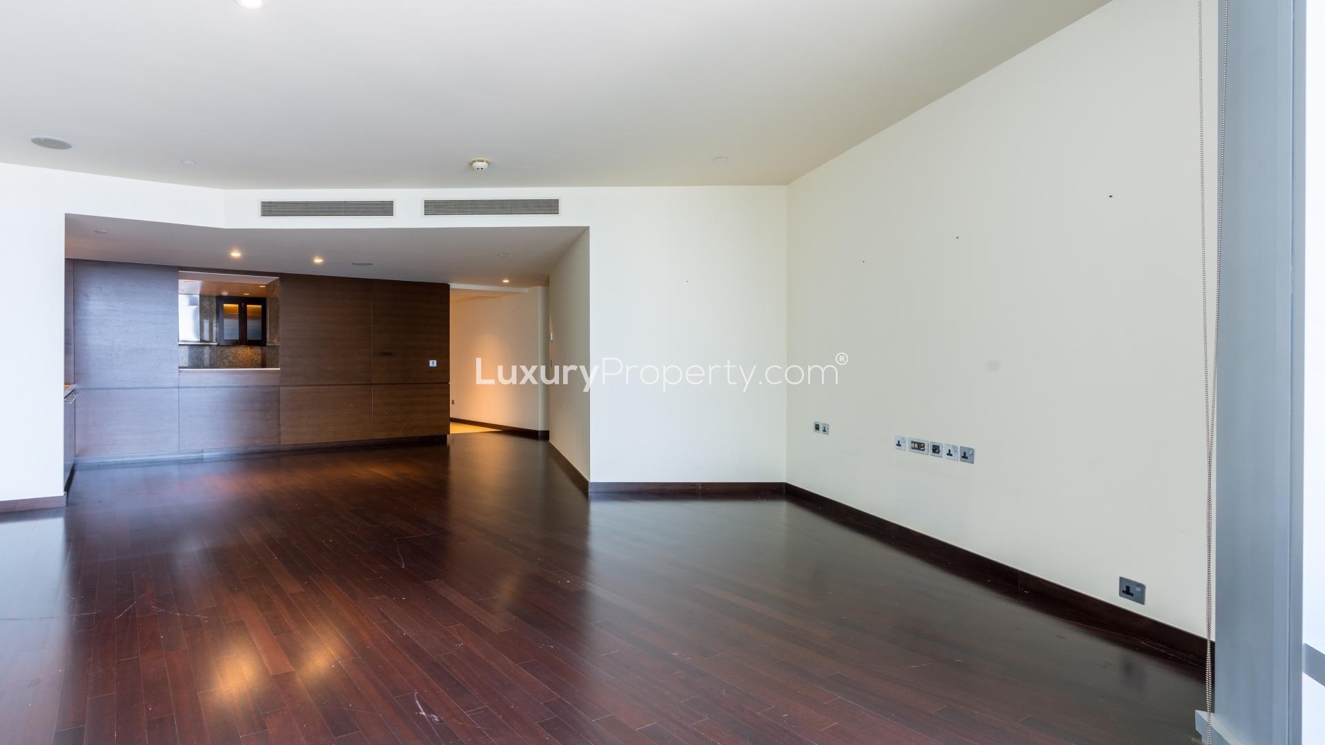 Luxurious Burj Khalifa apartment interior with hardwood floors and city view windows
