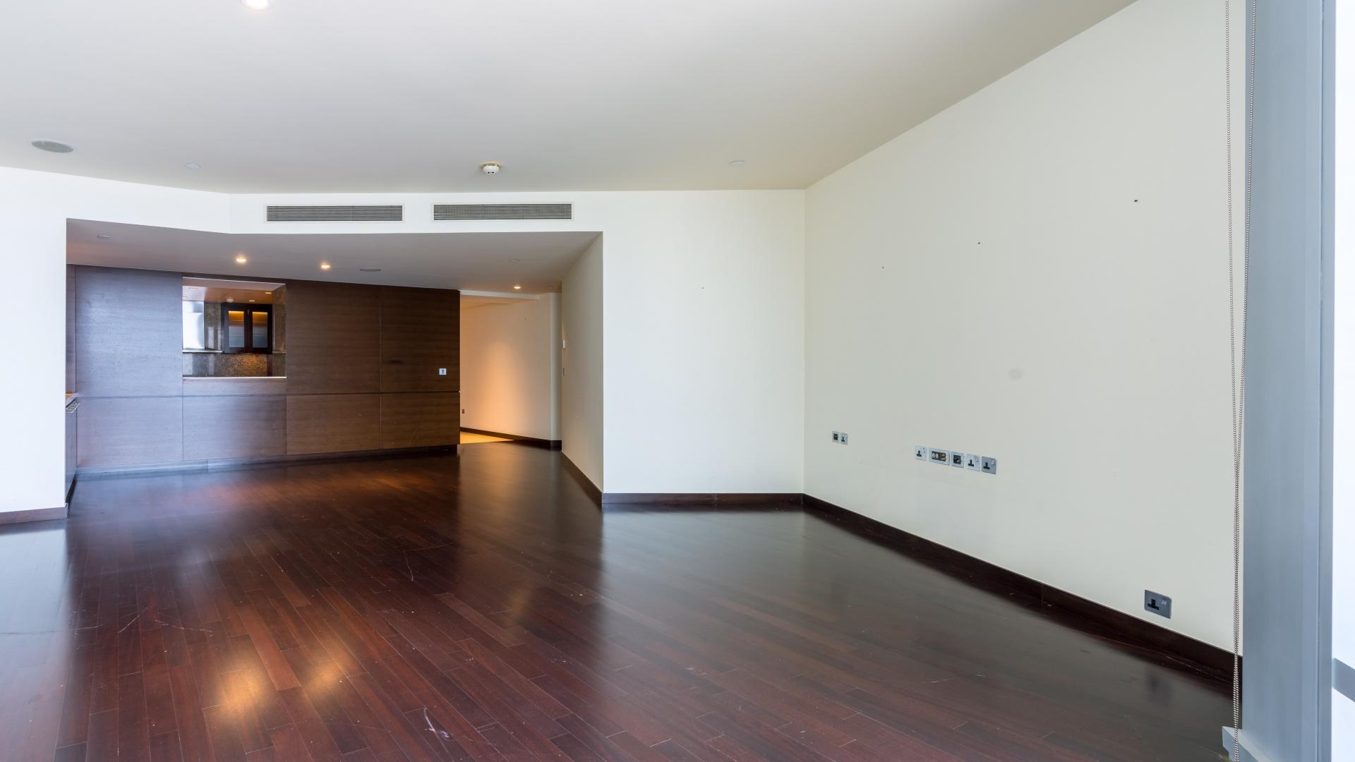 Luxurious Burj Khalifa apartment interior with hardwood floors and city view windows