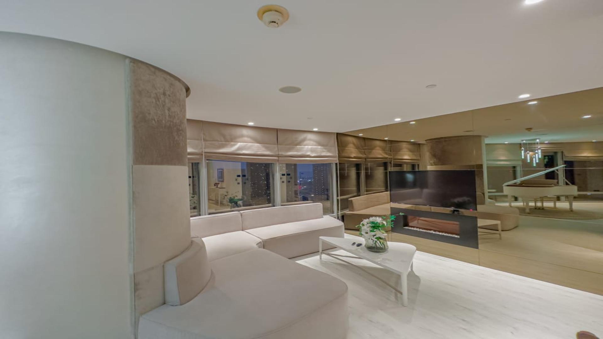 Luxurious living room with grand piano in Burj Khalifa apartment, Downtown Dubai