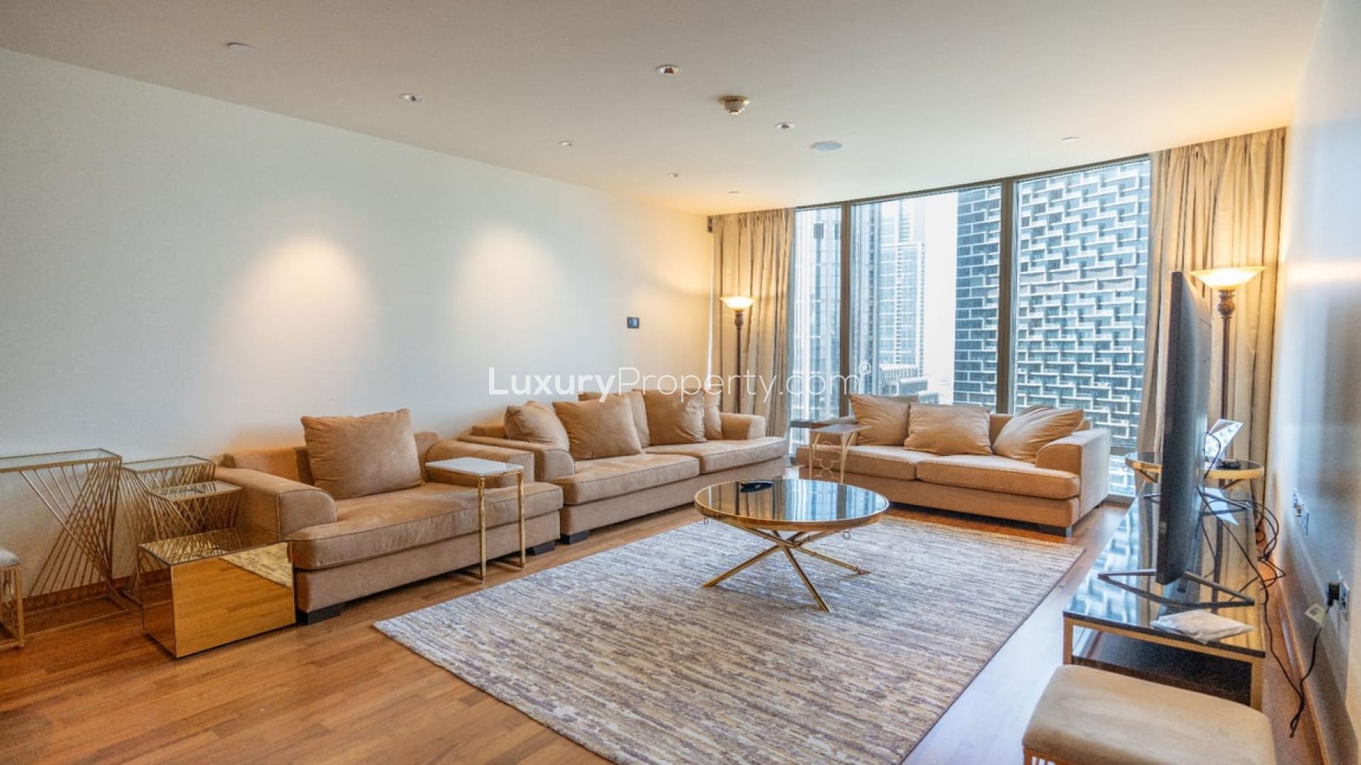 Luxurious living room in Burj Khalifa apartment with modern decor and large TV
