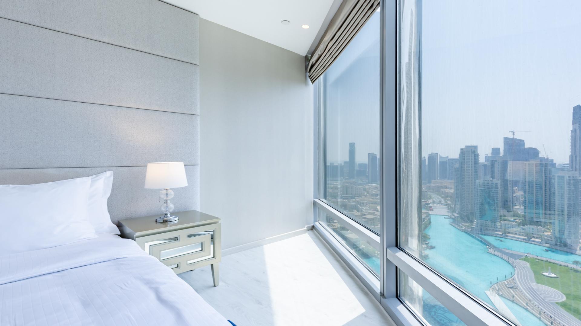 Luxurious Burj Khalifa apartment interior with grand piano and panoramic skyline views