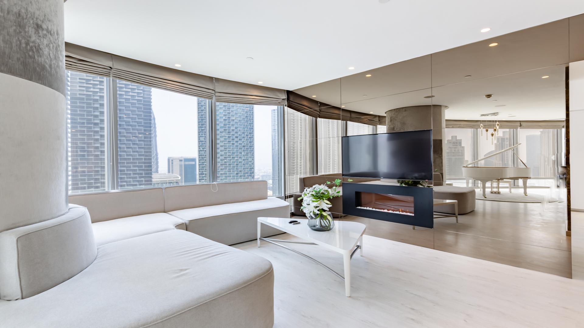 Upgraded kitchen in 2-bedroom Burj Khalifa apartment, featuring modern appliances and marble finishes