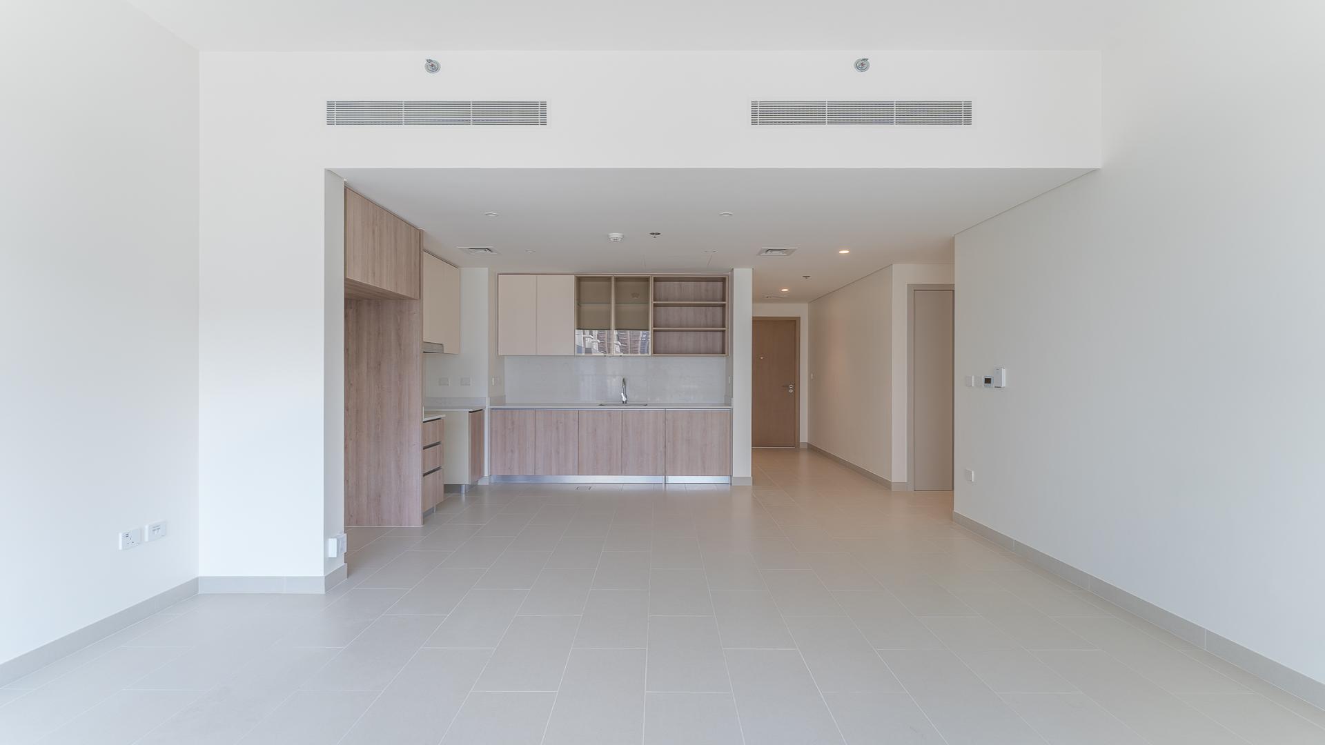 Modern kitchen and living area in Dubai Hills Estate apartment for rent, Park Field