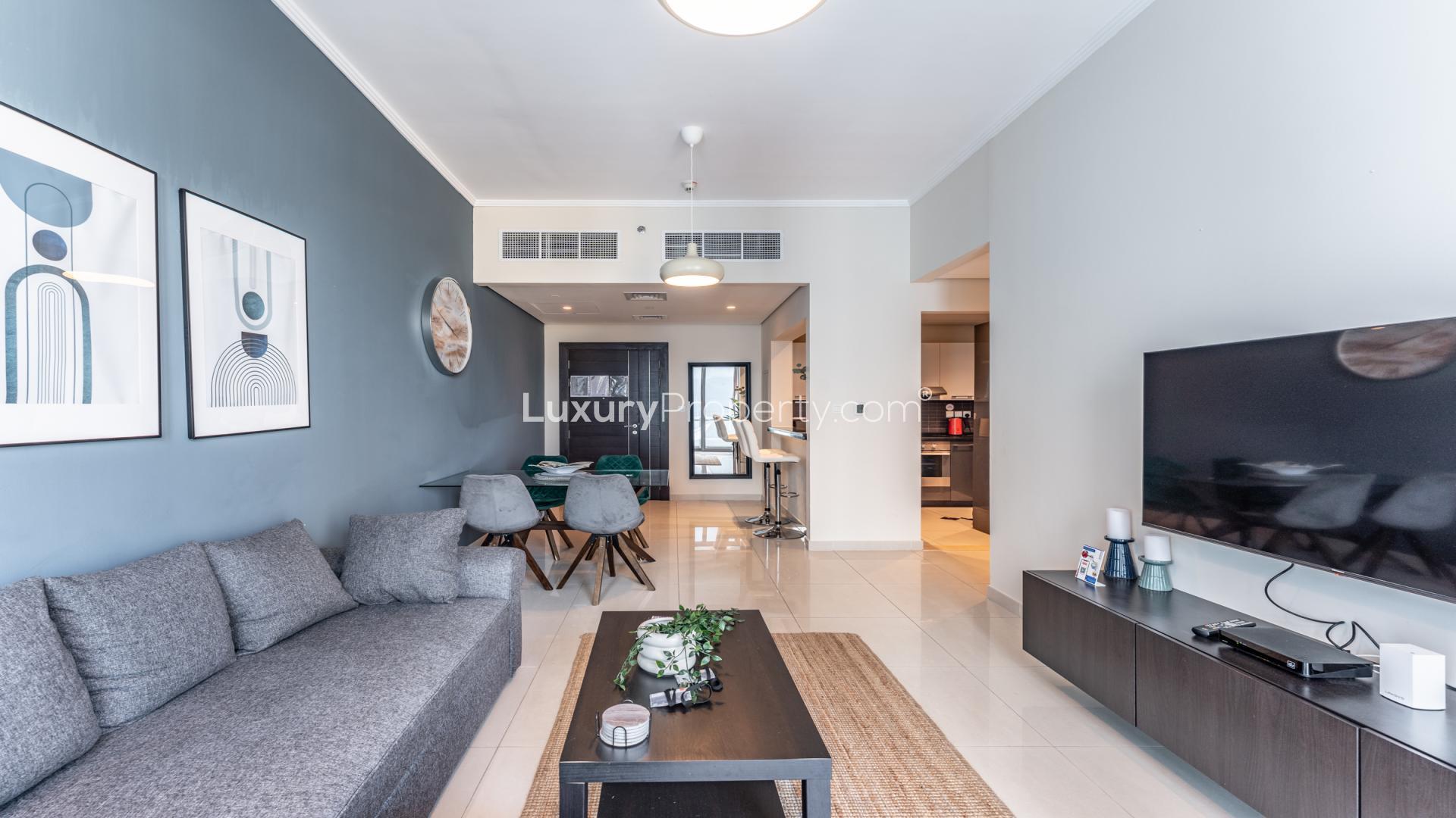 Modern living room in 2-bedroom furnished apartment, Silverene Towers, Dubai Marina, with balcony view