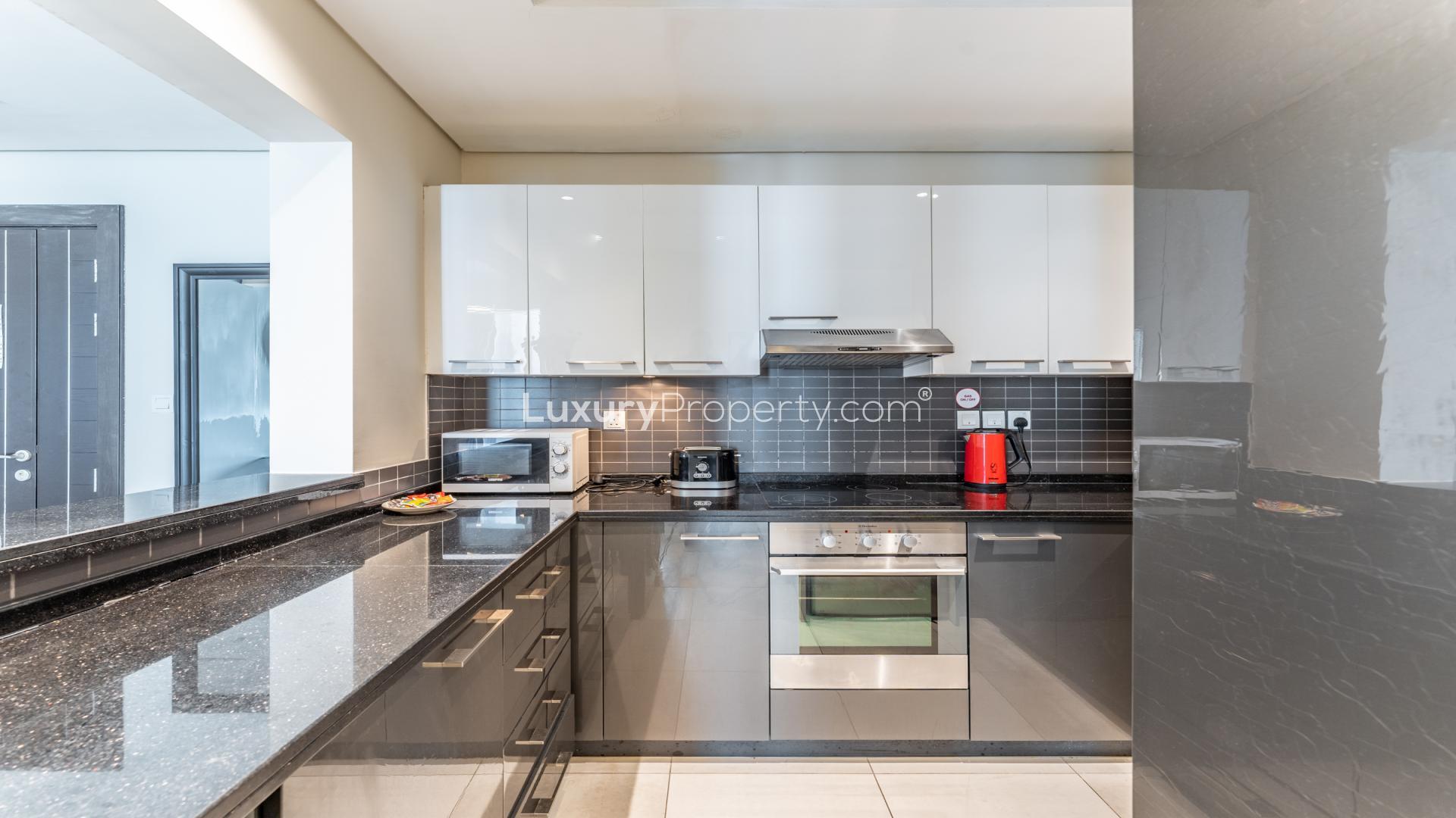 Modern kitchen in 2-bedroom furnished apartment, Silverene Towers, Dubai Marina, with sleek appliances