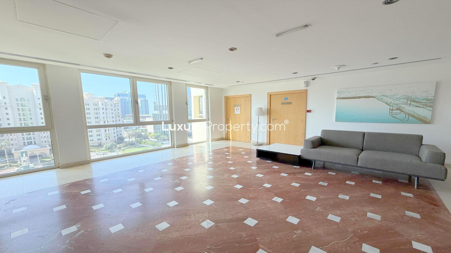 Furnished balcony view at Al Das Shoreline Apartments, Palm Jumeirah, with sea and building scenery