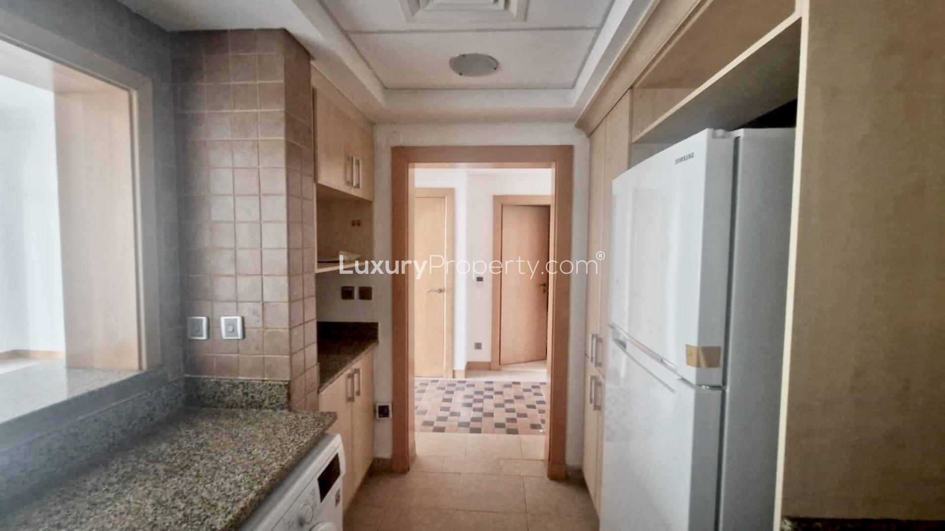 Empty living room with large windows in Palm Jumeirah Shoreline Apartments, Abu Keilbal