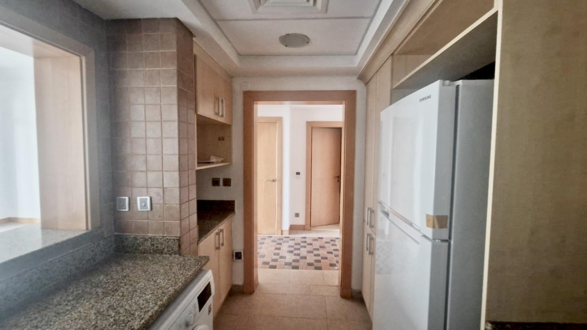 Empty living room with large windows in Palm Jumeirah Shoreline Apartments, Abu Keilbal