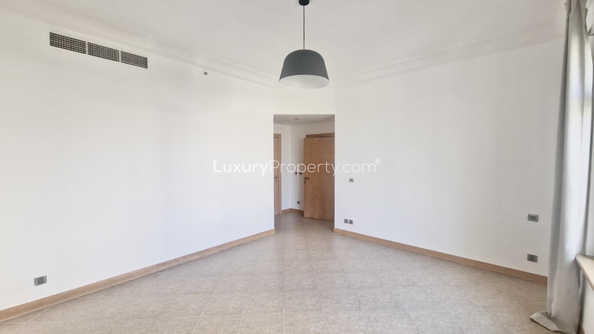 Empty living room with large windows in Palm Jumeirah Shoreline Apartments, Abu Keilbal
