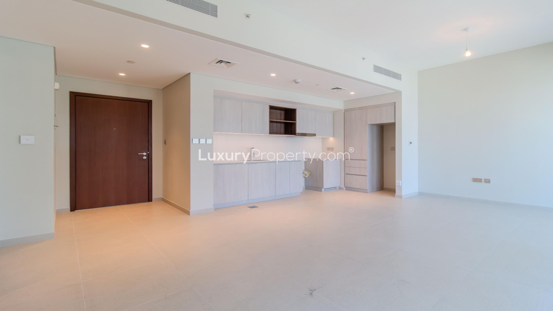 "Spacious living area in Dubai Creek Harbour apartment with large windows and modern finishings.",Spacious living area in brand new 2-bedroom apartment, Creek Beach, Dubai Creek Harbour