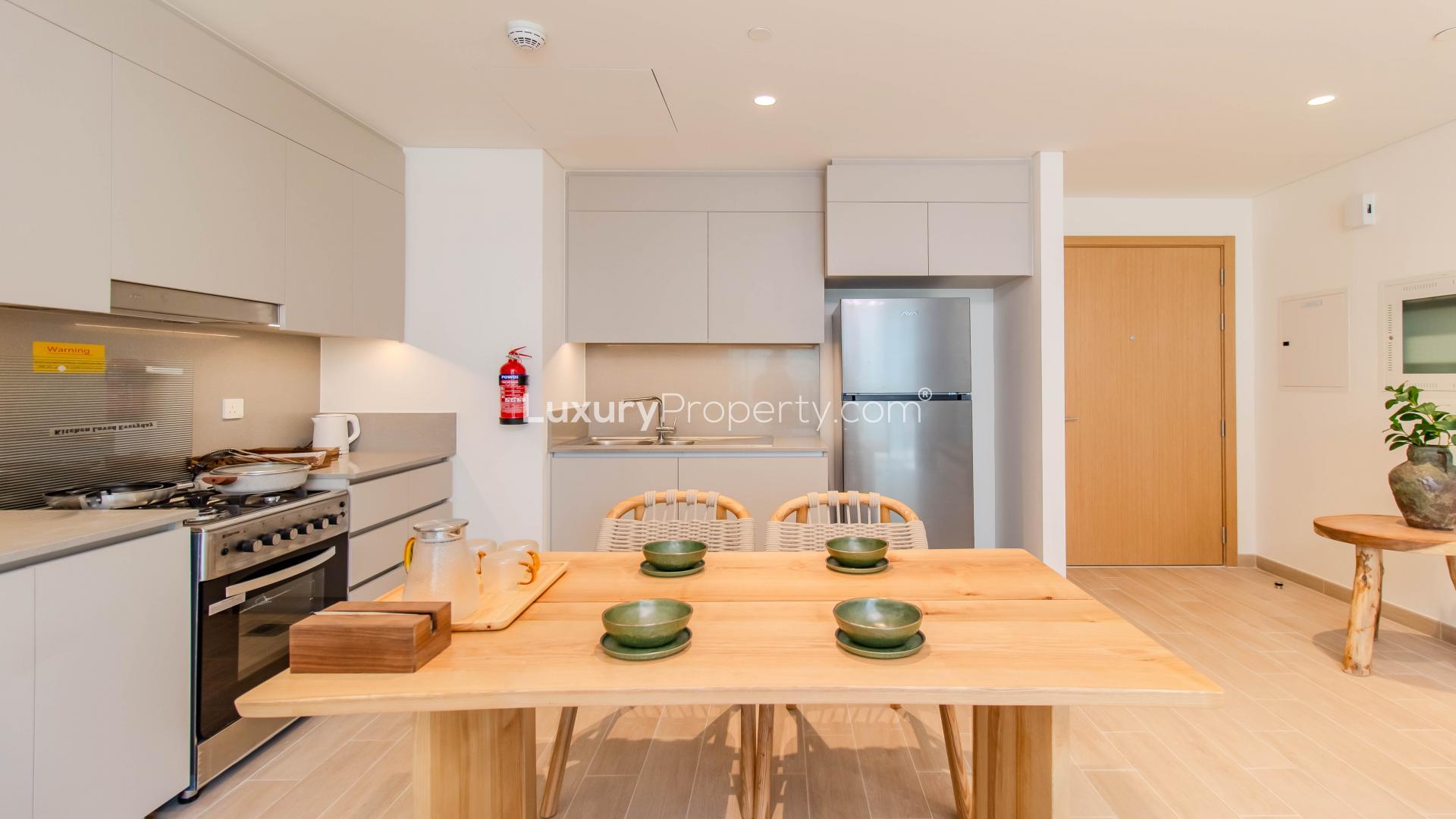 "Spacious balcony view of furnished apartment in Creek Beach, Dubai Creek Harbour for rent.",Modern kitchen in furnished 2-bedroom apartment, Creek Beach, Dubai Creek Harbour