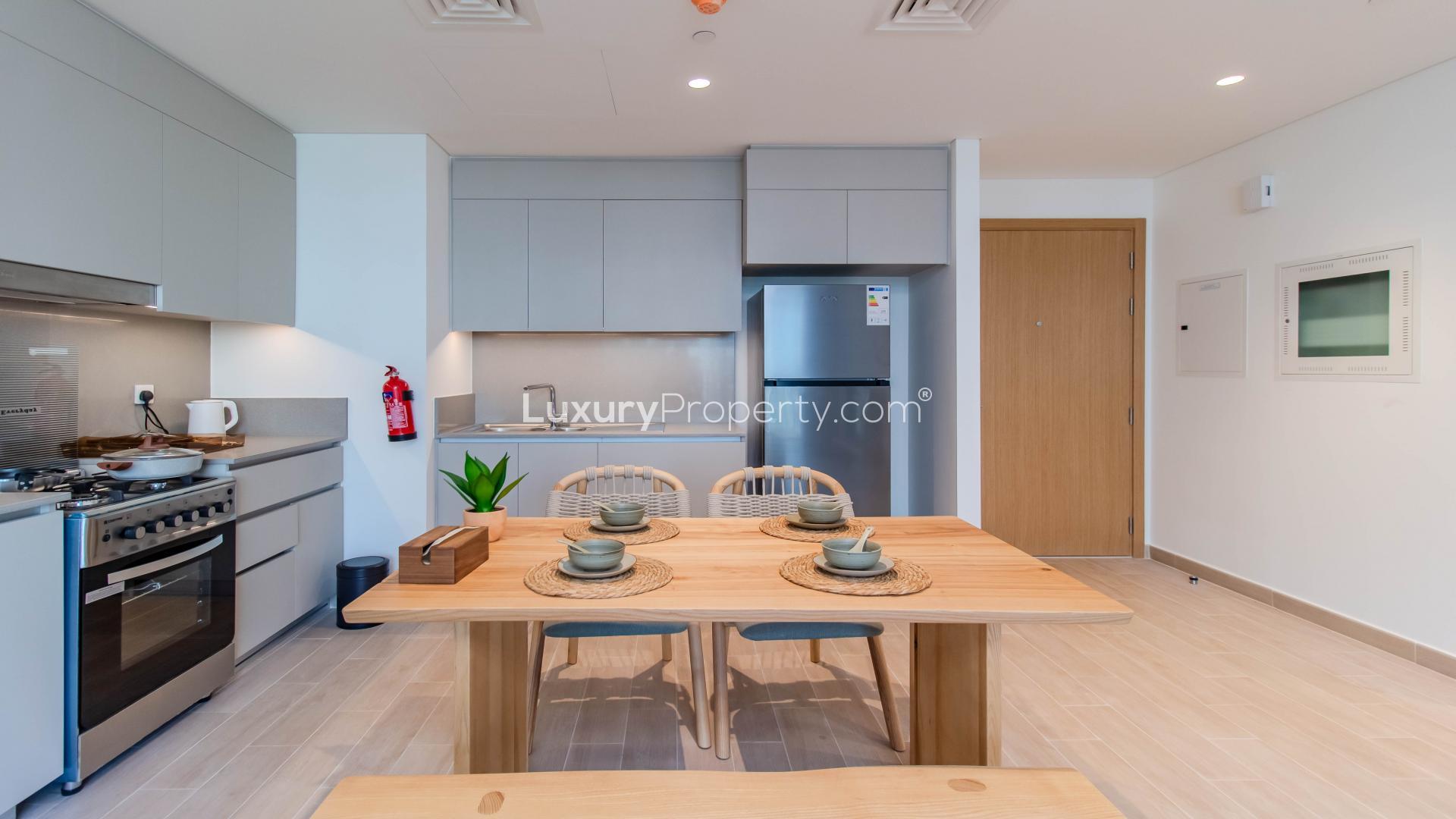 Furnished kitchen and dining area in Creek Beach apartment, Dubai Creek Harbour