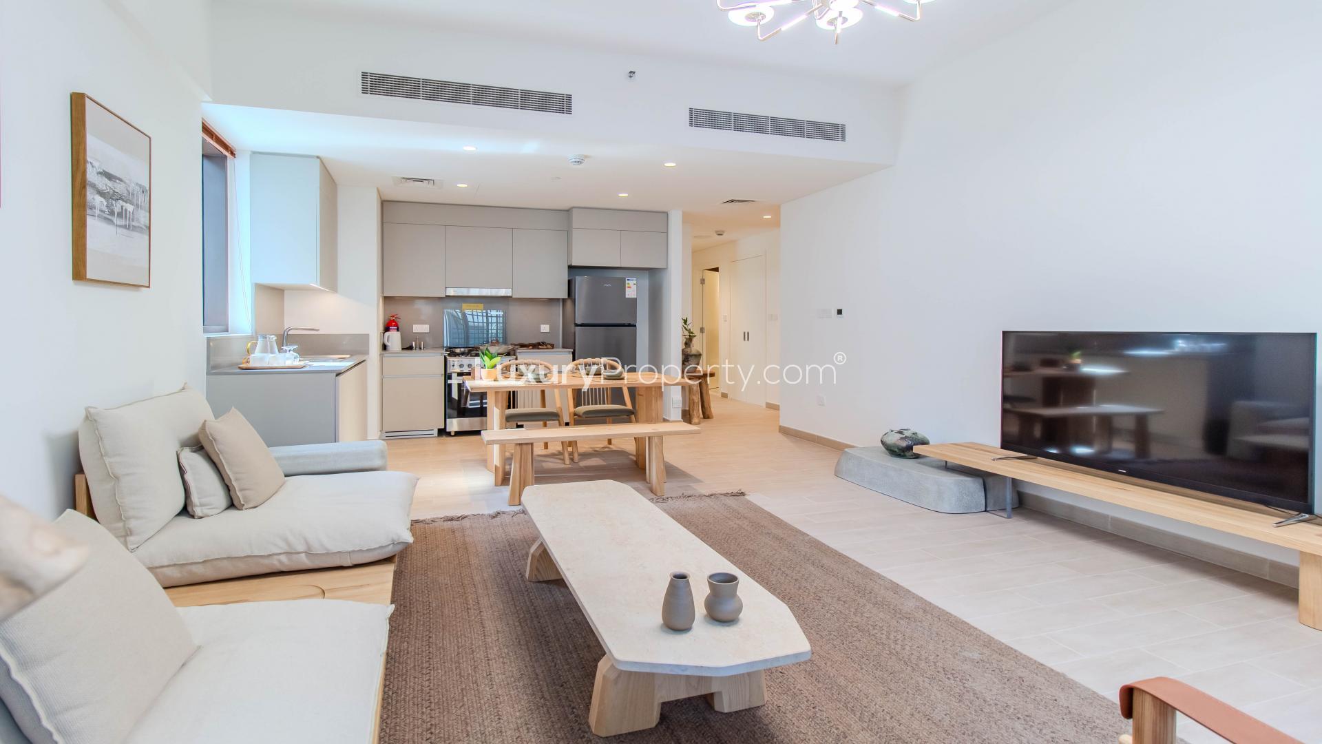 Furnished living room and kitchen in 2-bedroom apartment, Breeze at Creek Beach Dubai
