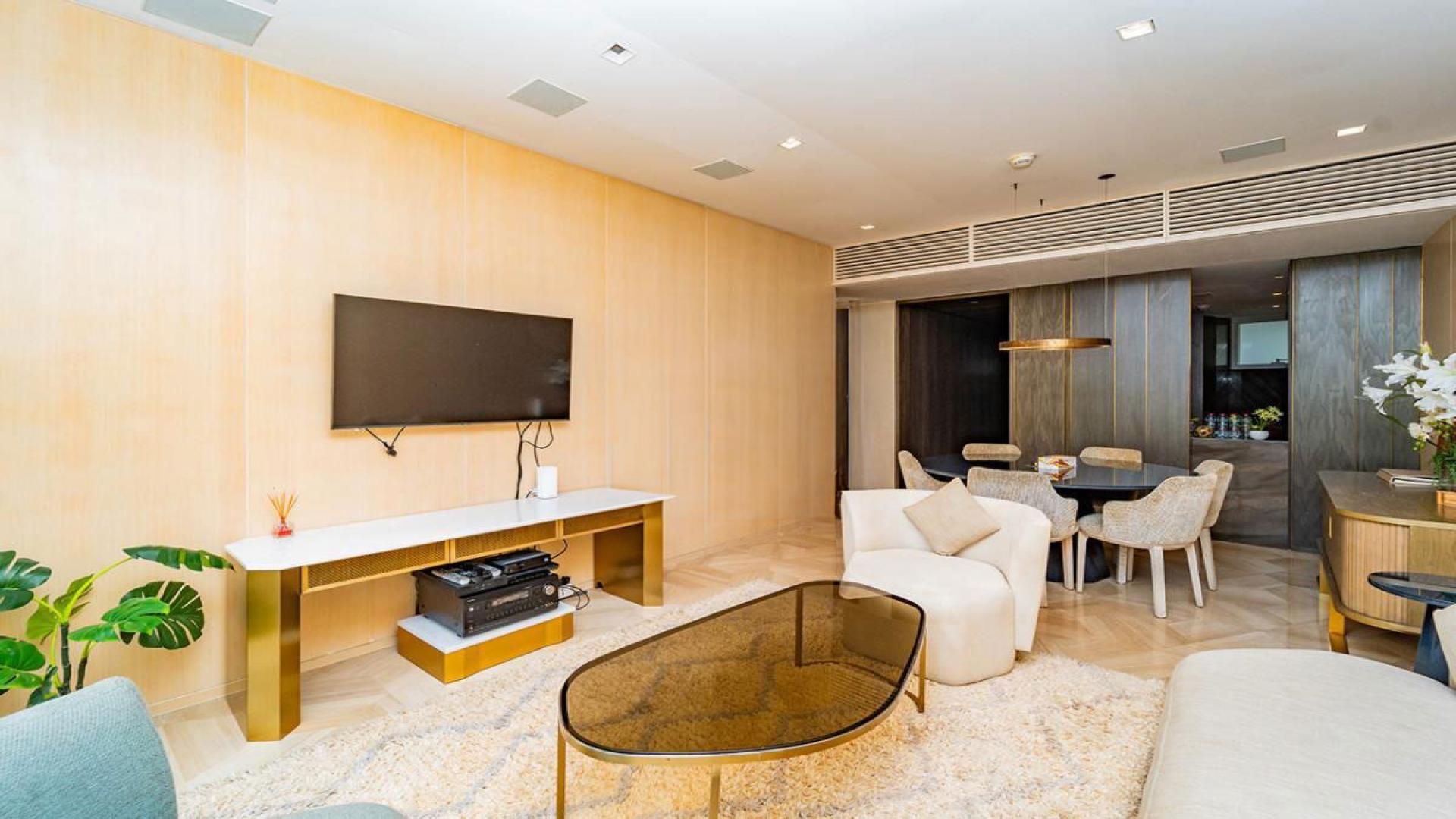 Fully furnished balcony view at Five Palm Jumeirah apartment for rent, lush greenery visible