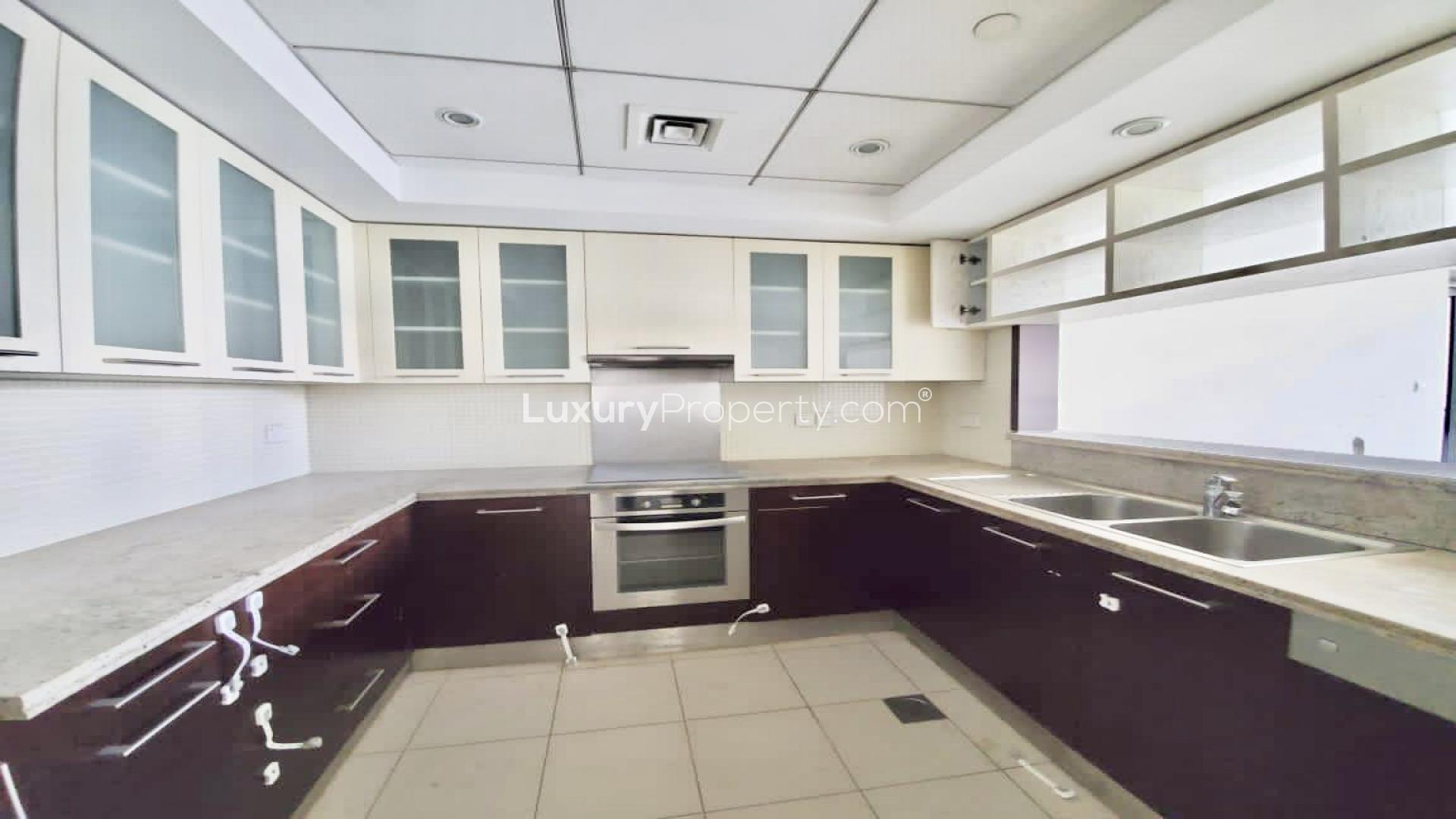 "Spacious living room with large windows in Boulevard Central Towers, Downtown Dubai apartment.",Modern kitchen in 2-bedroom apartment, Boulevard Central Towers, Downtown Dubai, with sleek cabinetry