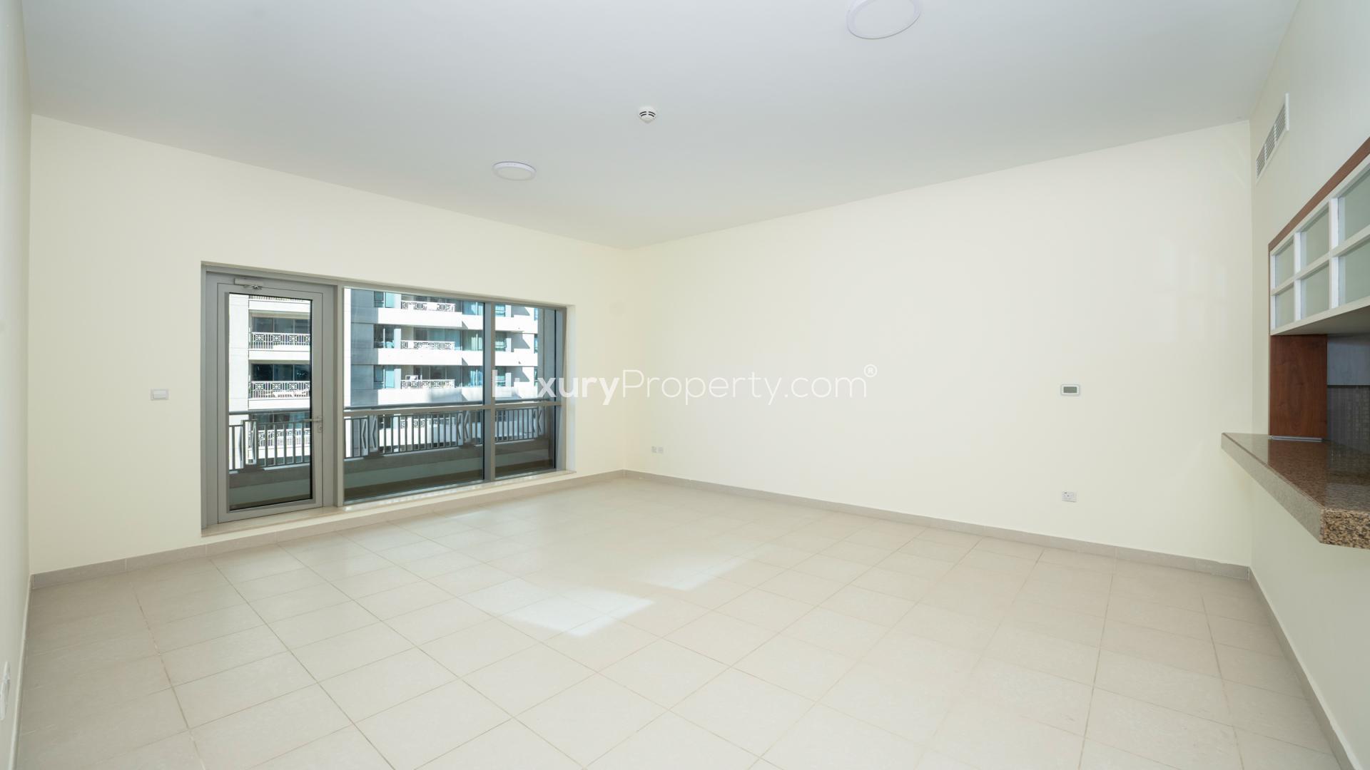 Vacant living room in Boulevard Central Towers apartment, Downtown Dubai, with large windows