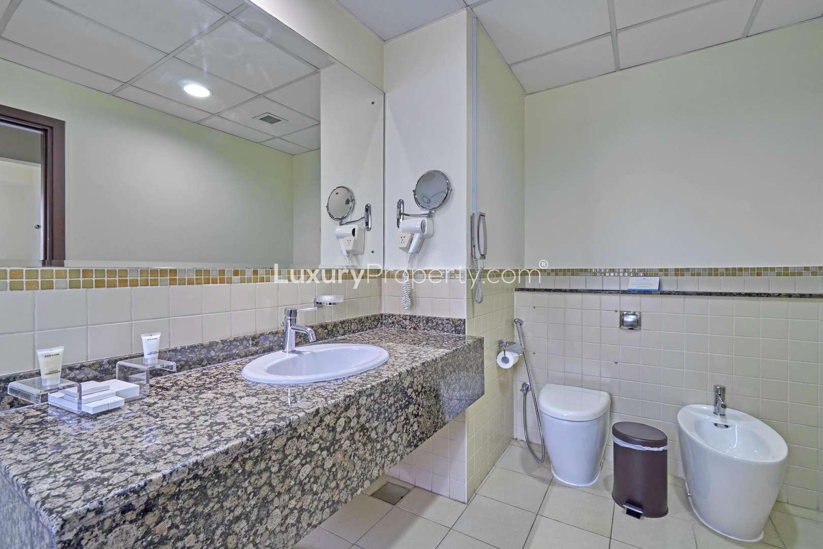 Bright bedroom with seating area in Roda Amwaj Towers apartment, Jumeirah Beach Residence