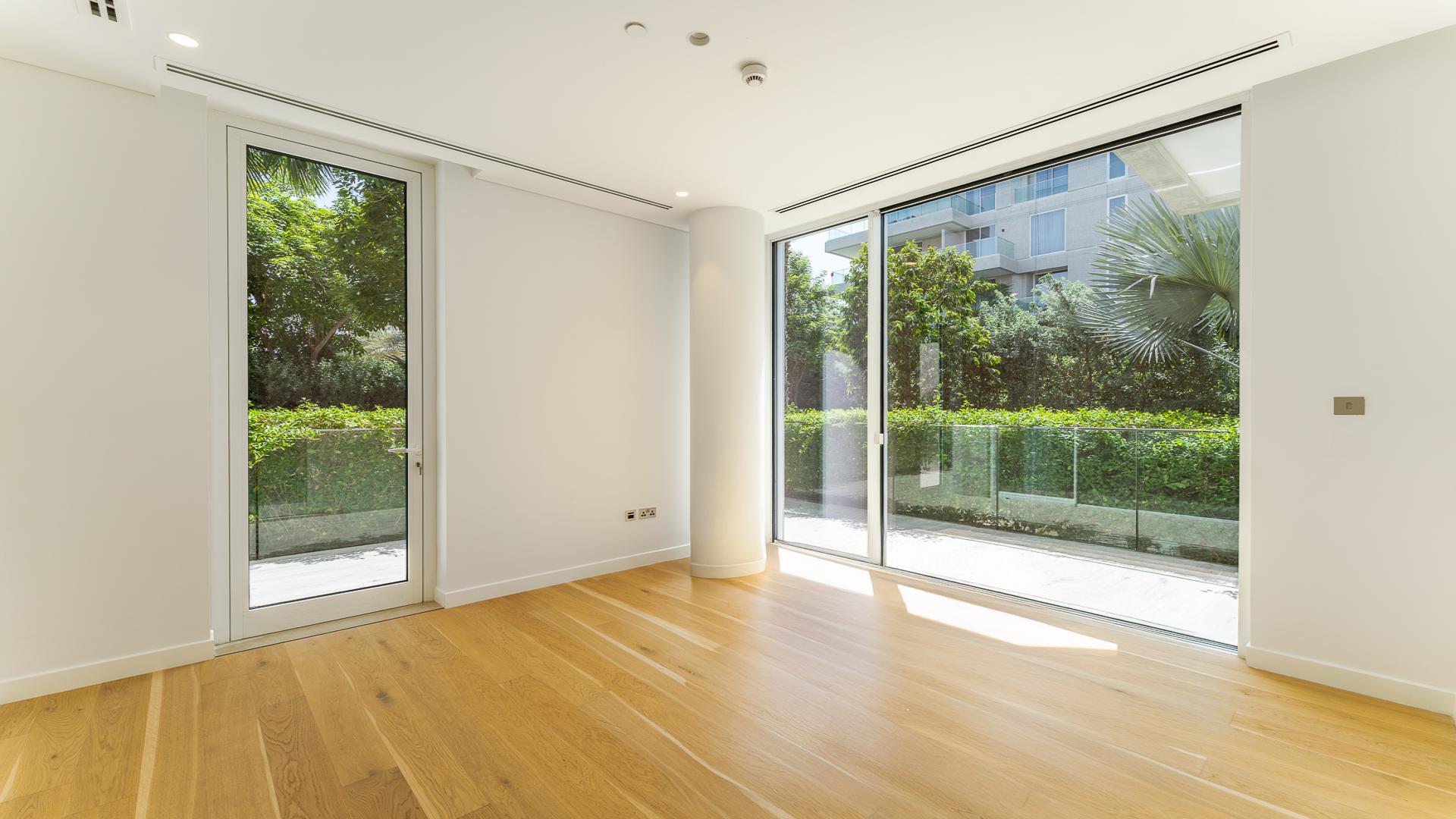 Ground floor apartment interior with wooden flooring in The Neighbourhood, Al Barari