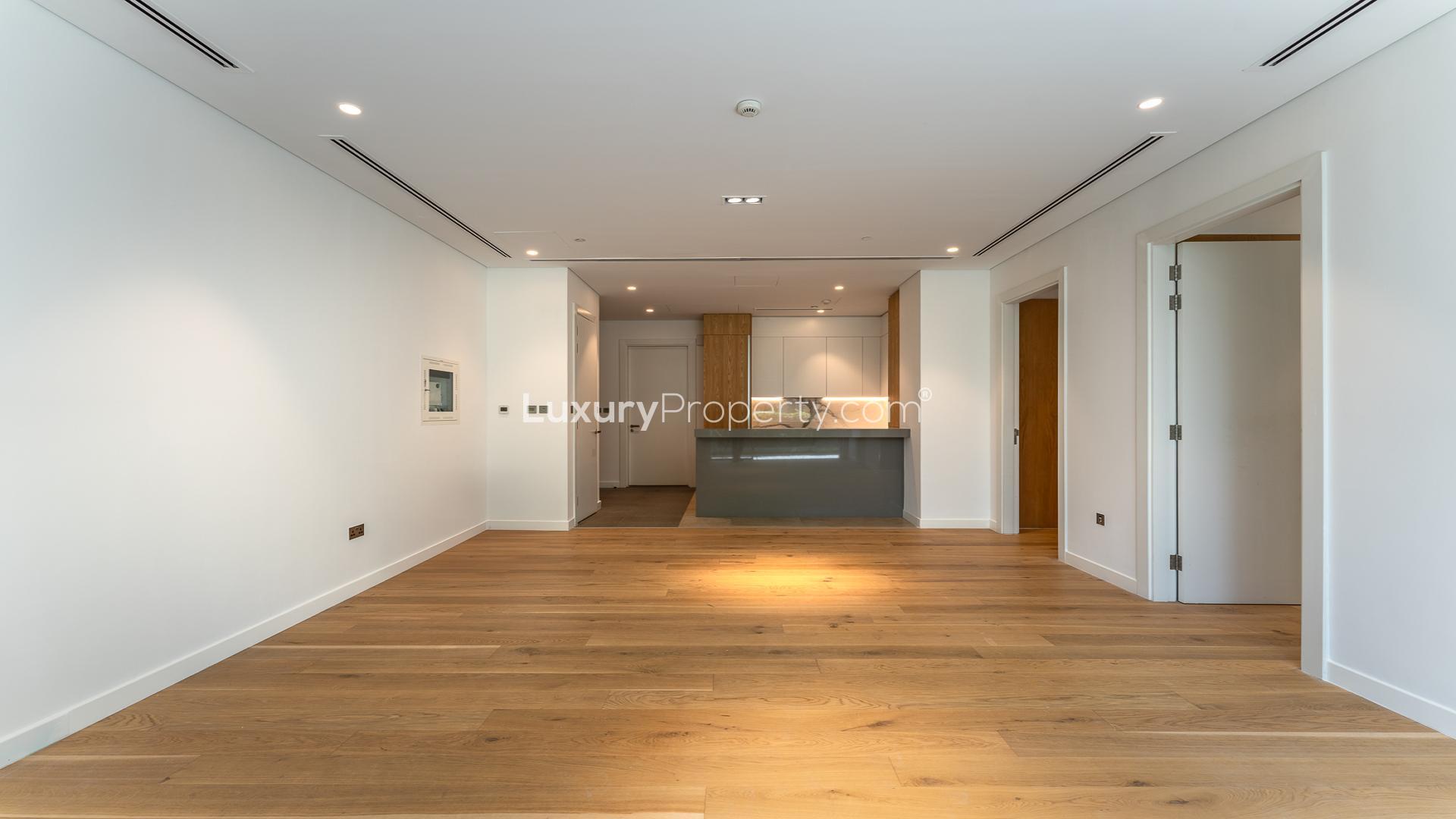 Ground floor apartment interior with wooden flooring in Al Barari's The Neighbourhood, Dubai
