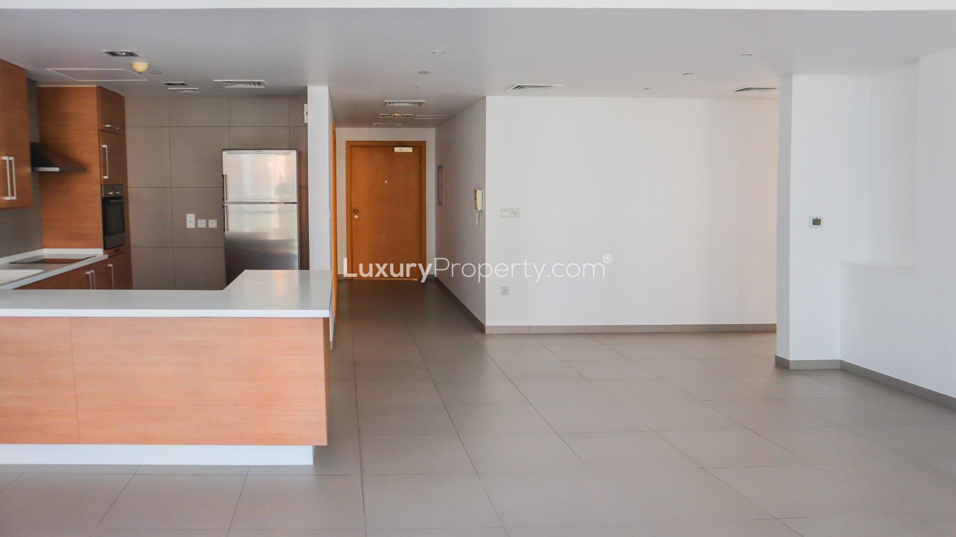 Contemporary Ariyana Tower apartment interior with large windows overlooking Dubai Marina community