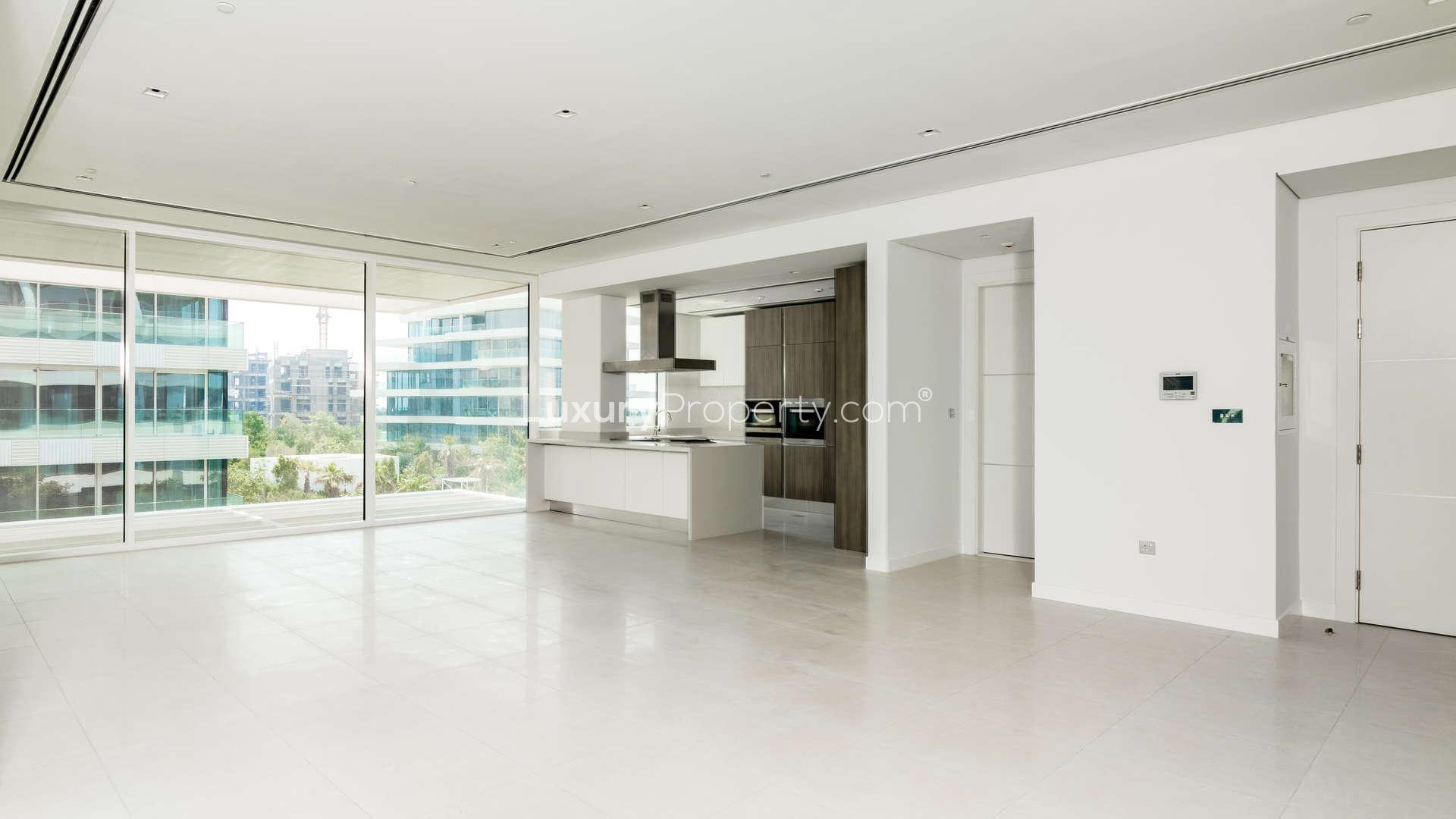 Modern kitchen in 2-bedroom apartment, Ashjar, Al Barari, featuring sleek design and ample lighting