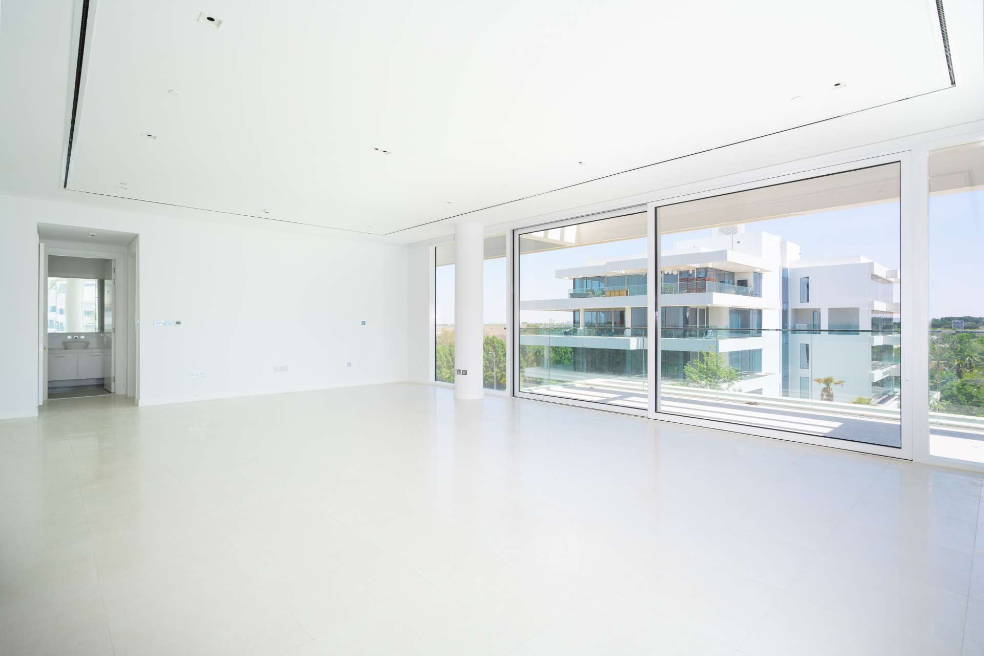 Modern 2-bedroom apartment exterior with lush greenery in Ashjar, Al Barari community