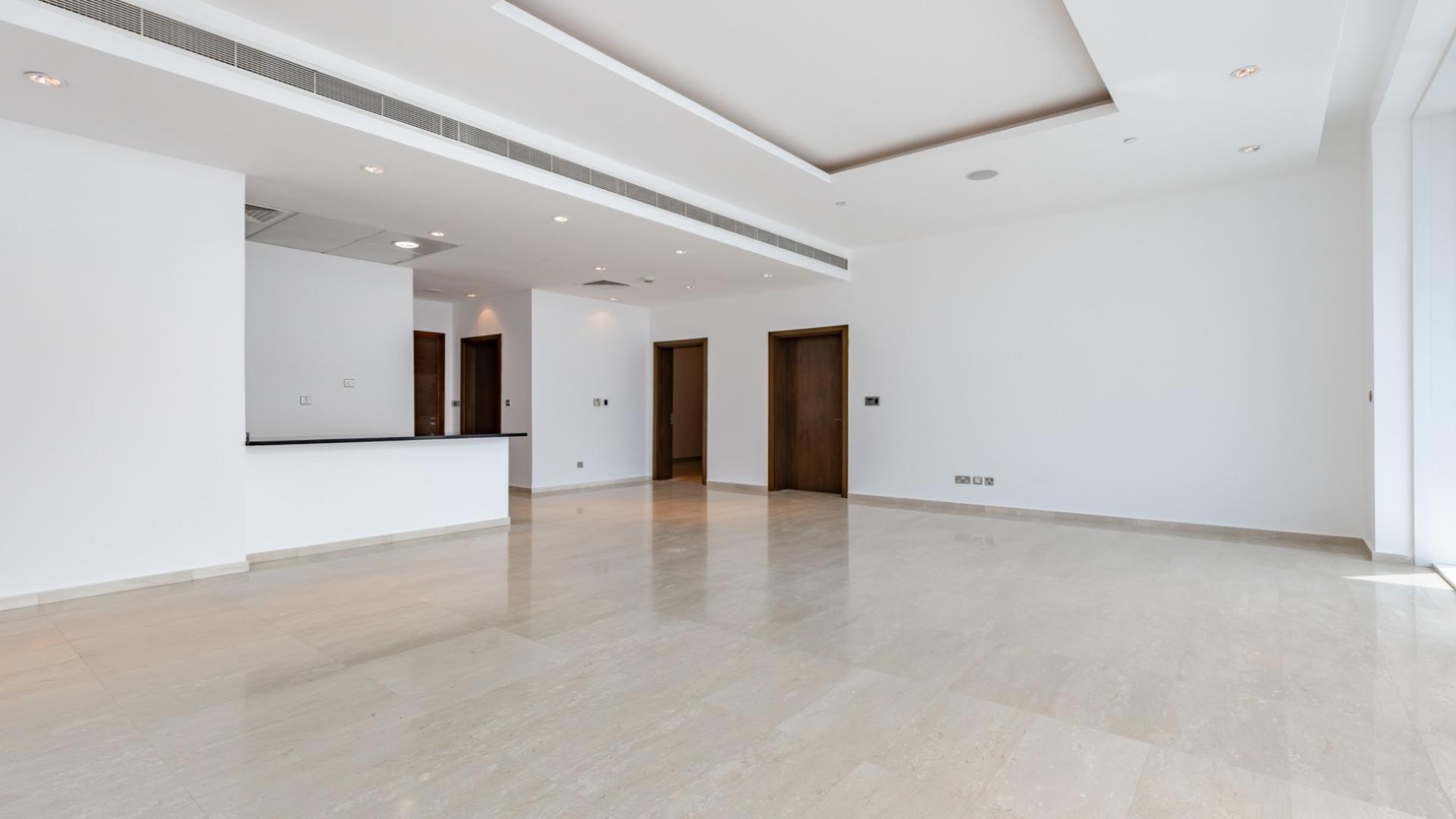 Spacious living room with large windows in Oceana apartment, Palm Jumeirah