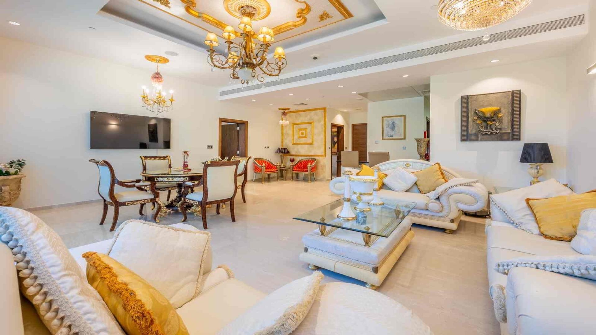 Luxurious living room in Palm Jumeirah apartment, featuring elegant furnishings and decor