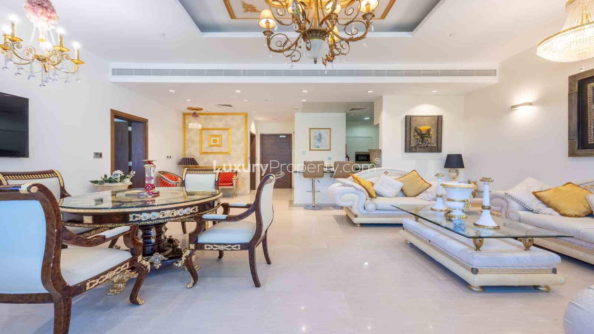 Luxurious living room in Oceana apartment, Palm Jumeirah, with elegant furnishings and garden view