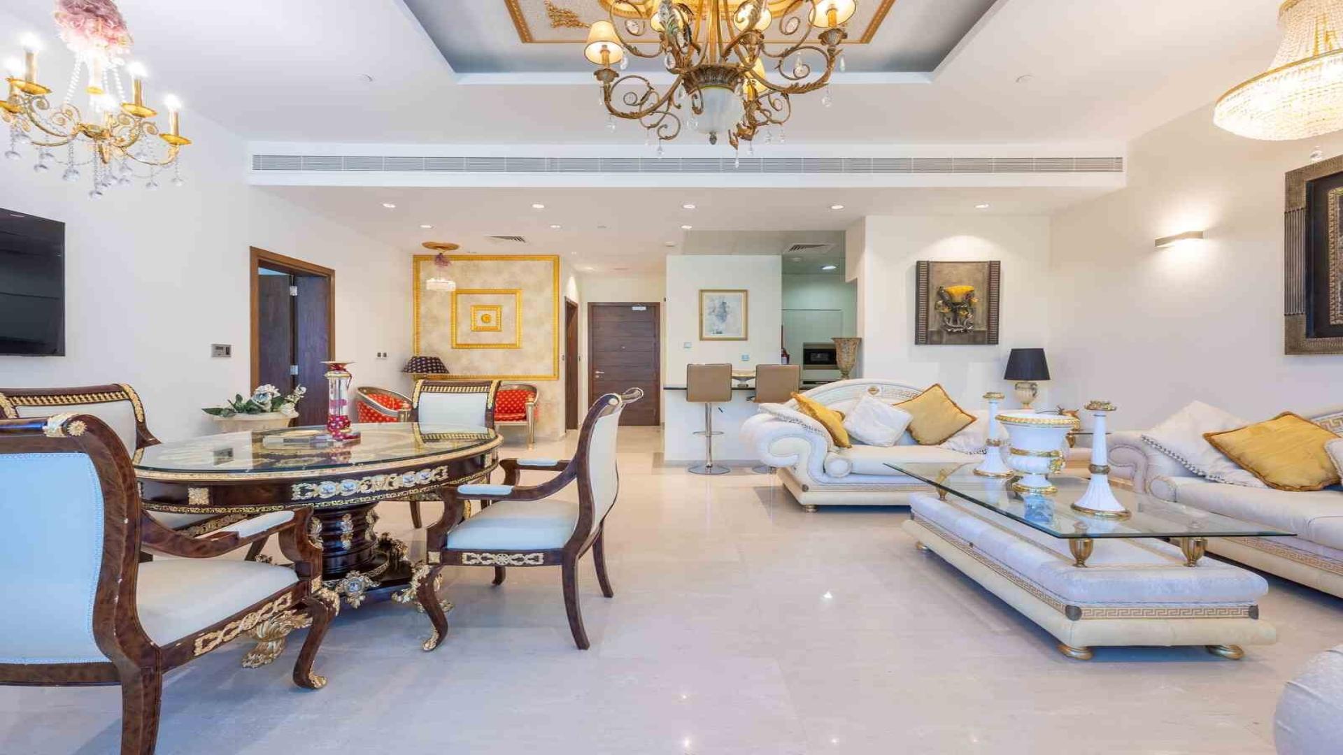 Luxurious living room in Oceana apartment, Palm Jumeirah, with elegant furnishings and garden view
