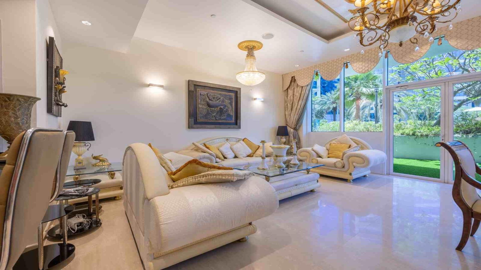 Luxurious living room in Oceana apartment, Palm Jumeirah, featuring elegant decor and modern furnishings