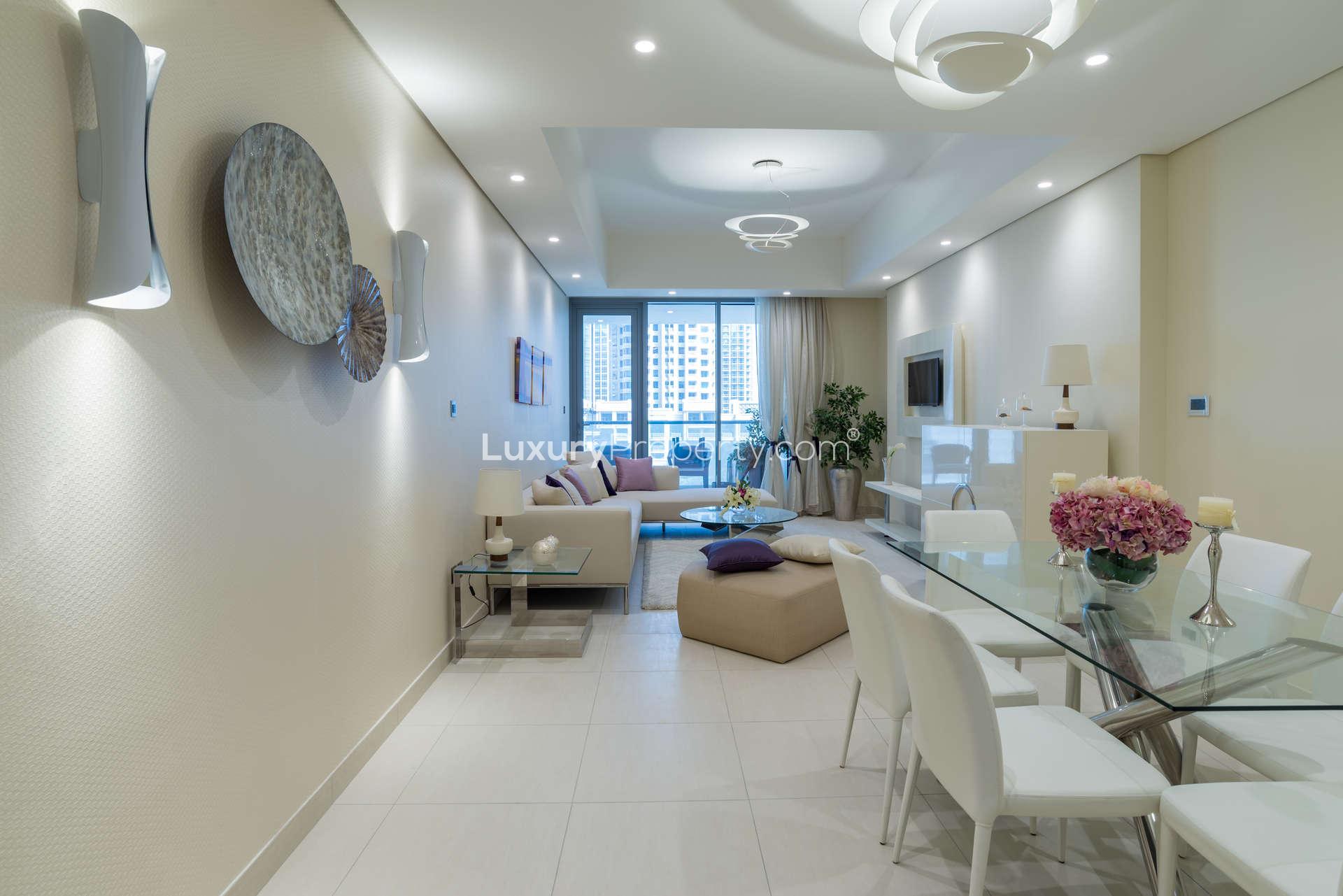 Modern living room in Bahwan Tower apartment, Abu Shagara, with elegant decor and natural light