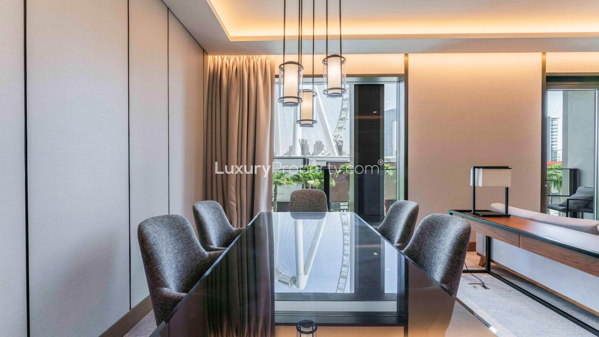 Modern kitchen and living area in Bluewaters apartment, featuring sleek design and natural light