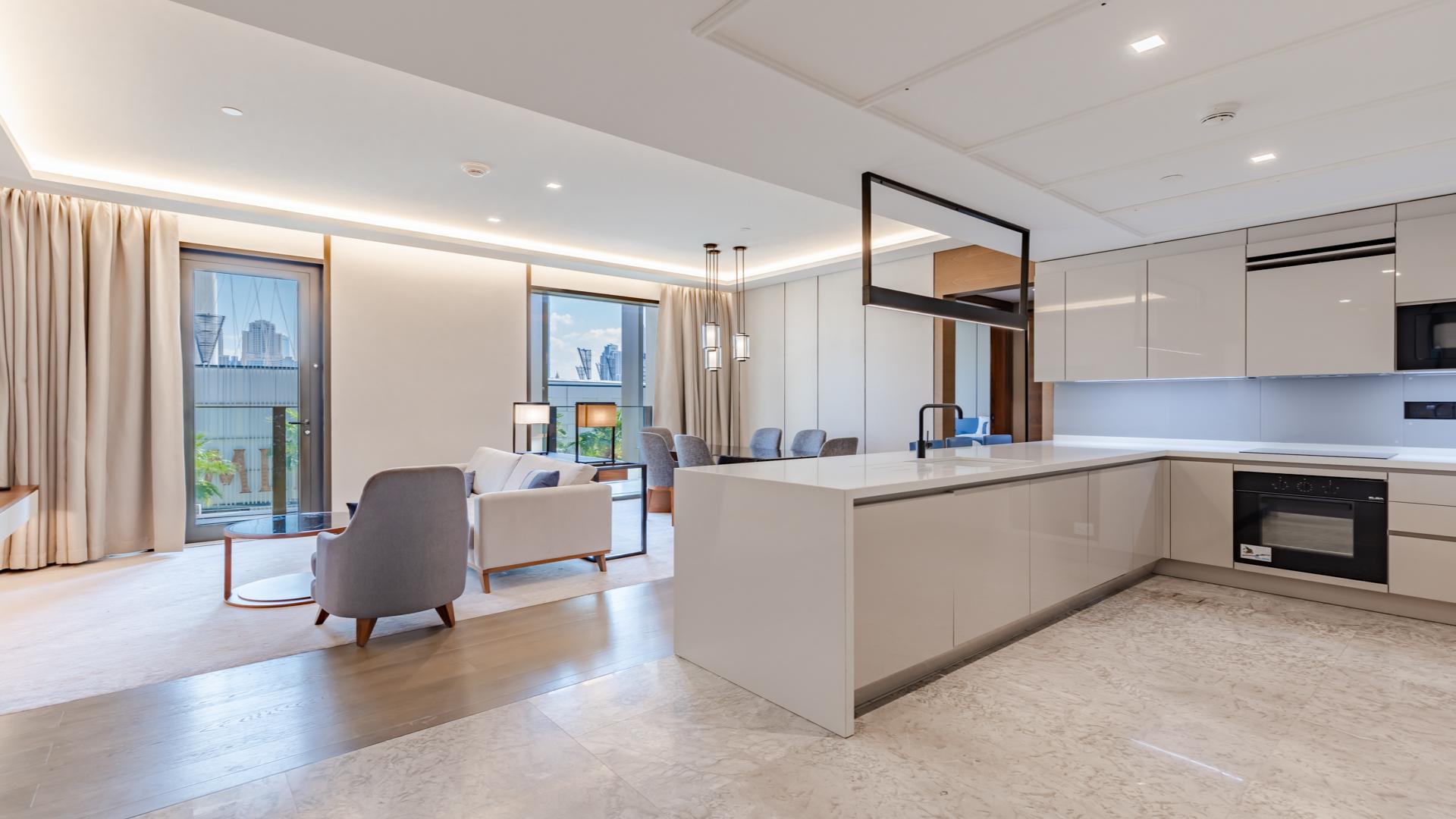 Modern living room in Bluewaters apartment with sea views, elegant furnishings, and natural light