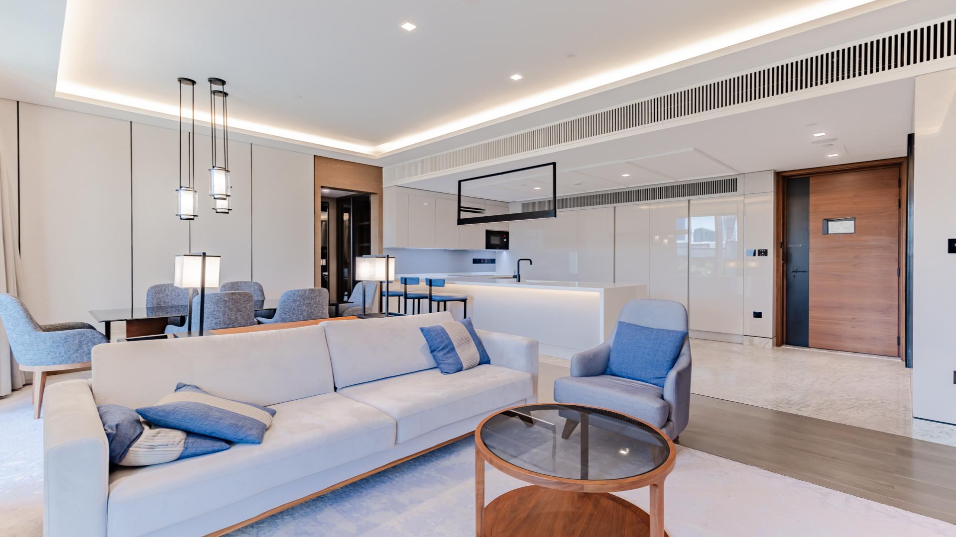 Modern living room in Bluewaters apartment with sea and marina views, Dubai