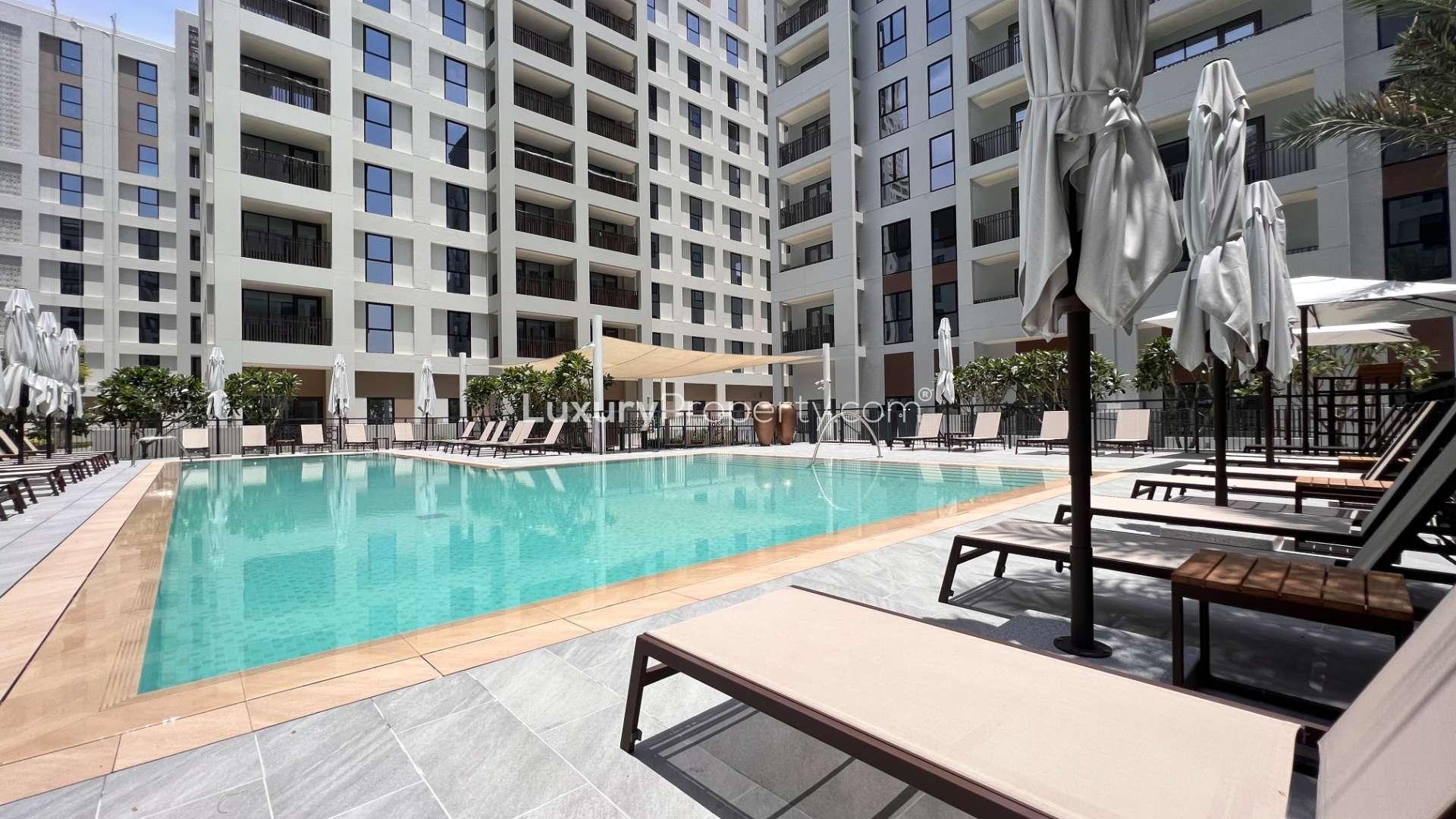 Luxury apartment pool area in Bayshore, Dubai Creek Harbour, surrounded by modern buildings
