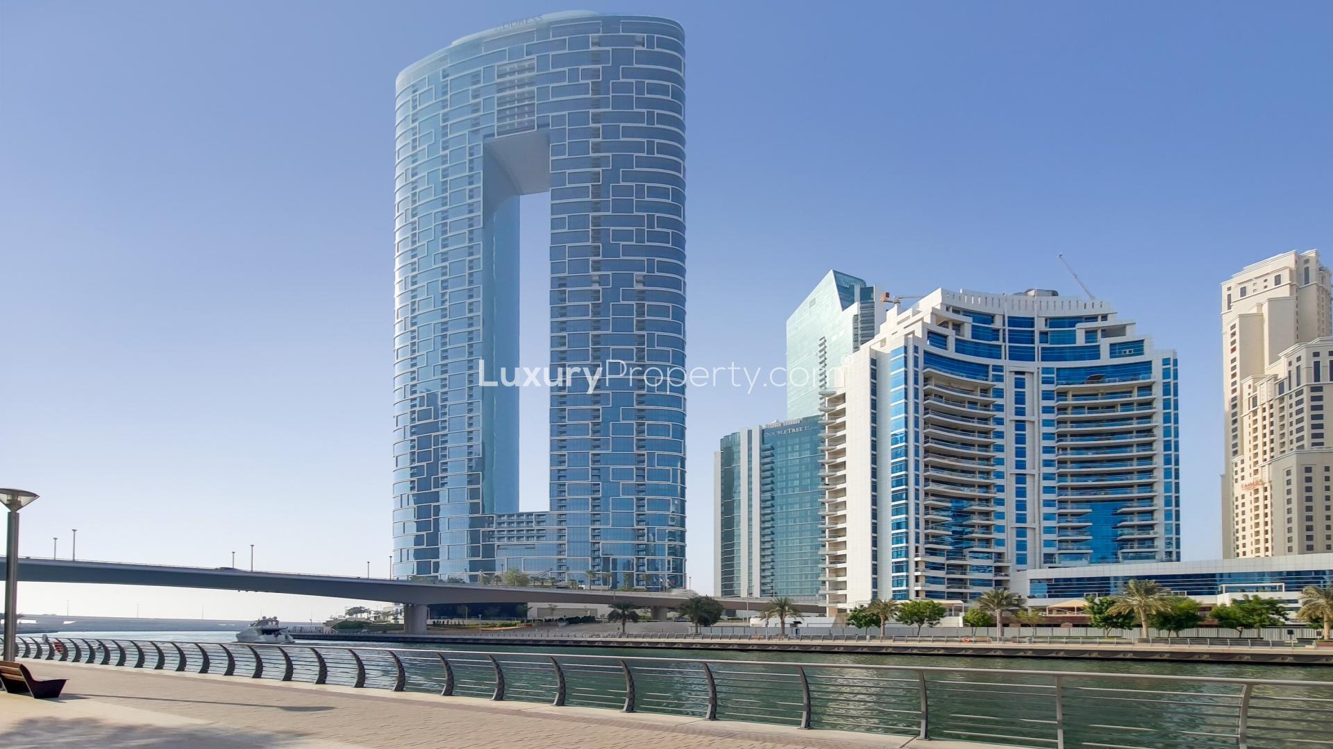 Modern living room with balcony view in luxury JBR apartment for rent