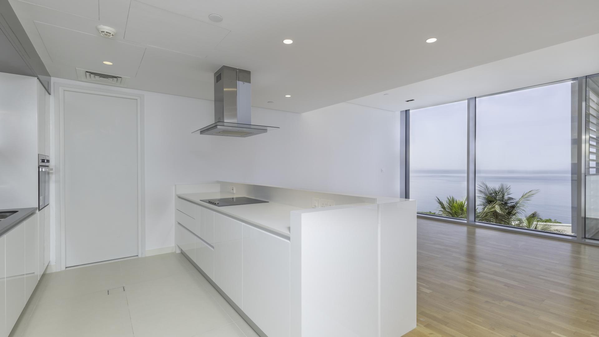 "Stunning sea view from Bluewaters Residences apartment with lush greenery and modern architecture.",Modern kitchen with sea views in Bluewaters Residences apartment for rent, Ref LP13125