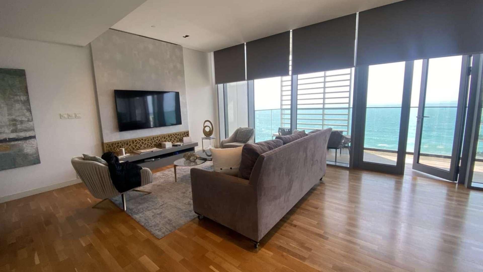 Modern living room with sea view in Bluewaters Residences apartment, featuring elegant decor